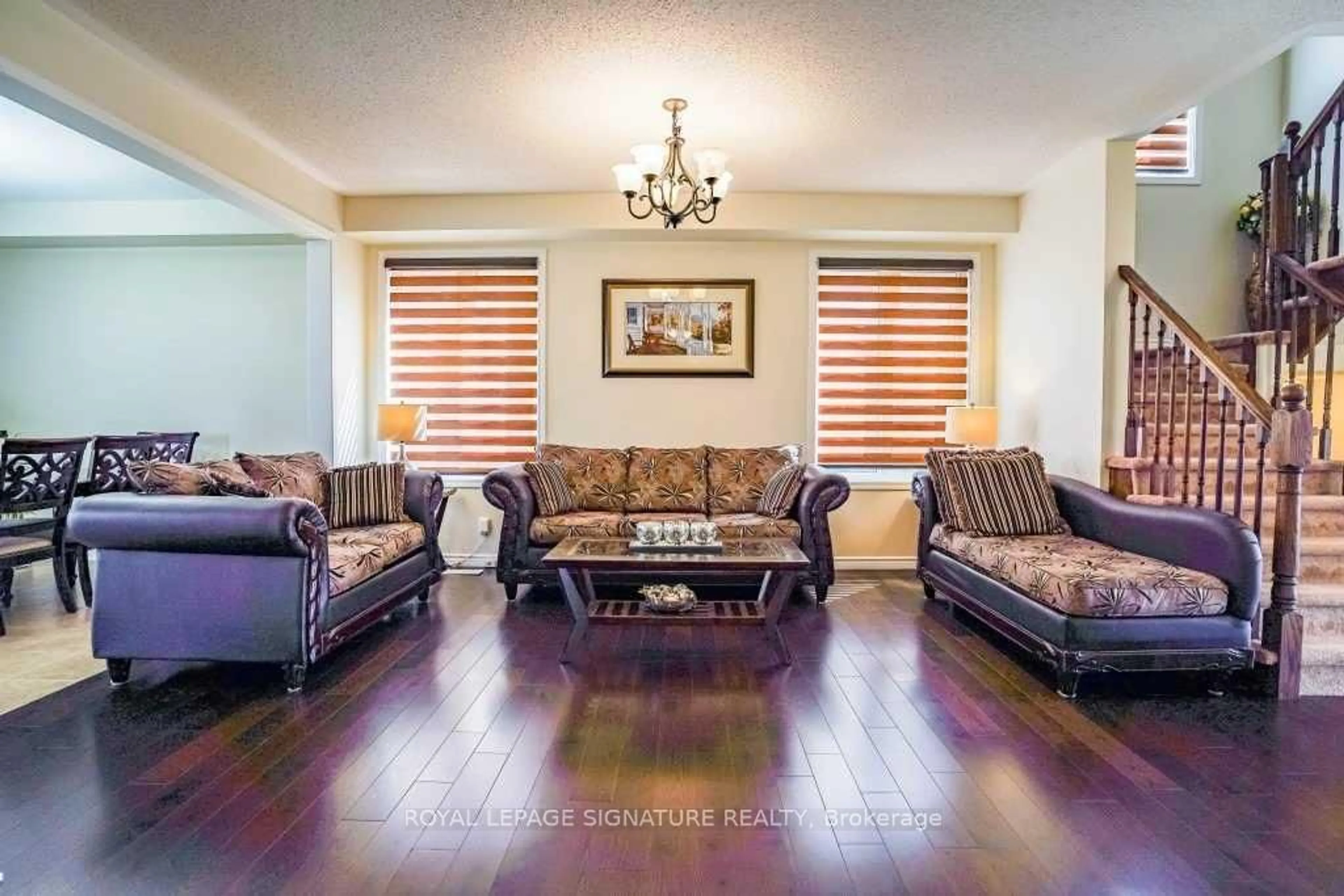 Living room with furniture, wood/laminate floor for 171 Buick Blvd, Brampton Ontario L7A 0Z1