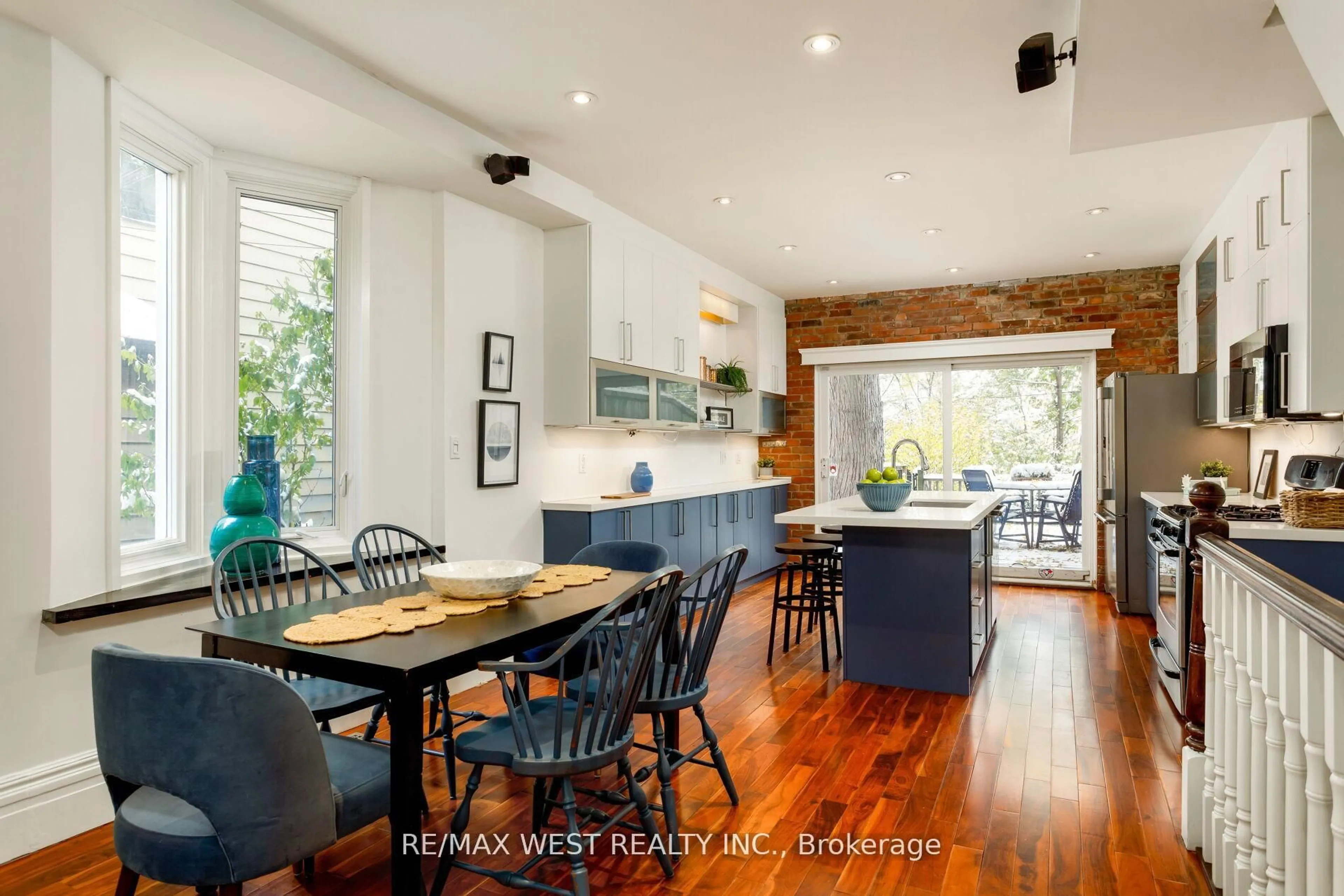 Open concept kitchen, wood/laminate floor for 79 Springhurst Ave, Toronto Ontario M6K 1B7