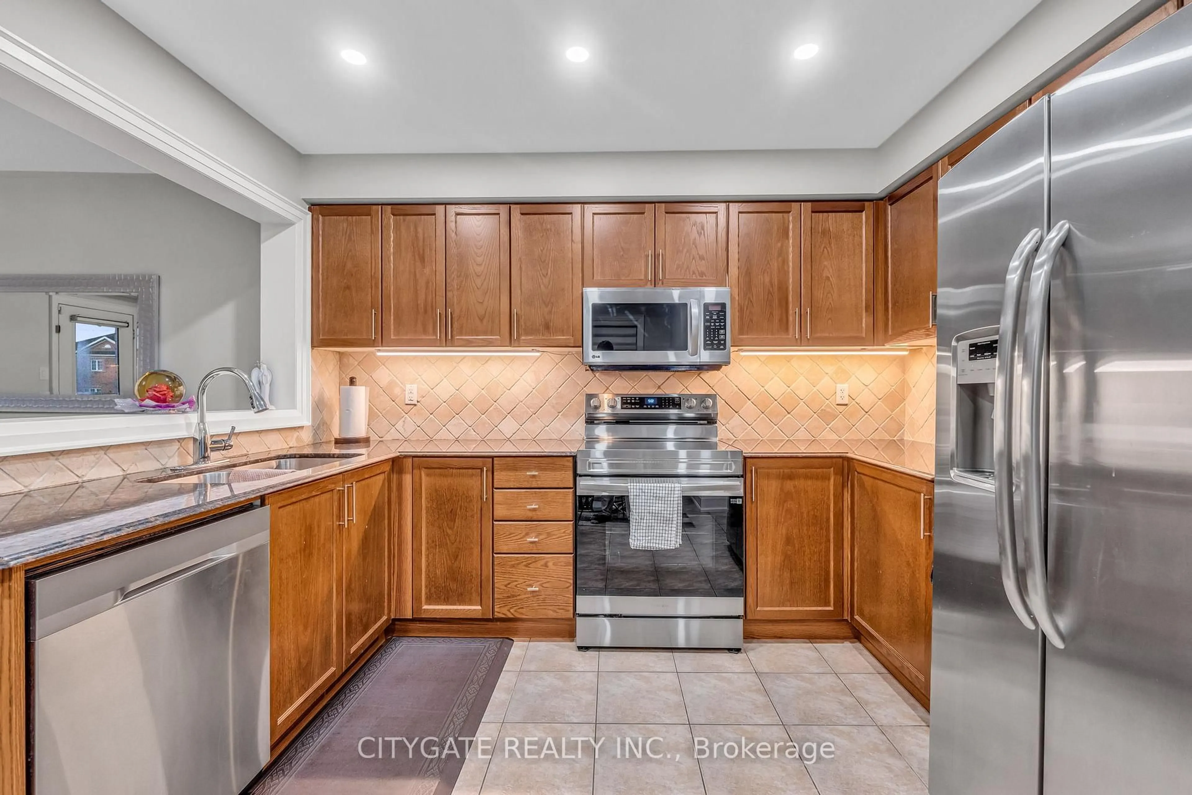 Open concept kitchen, ceramic/tile floor for 151 Spicebush Terr, Brampton Ontario L6X 0K6