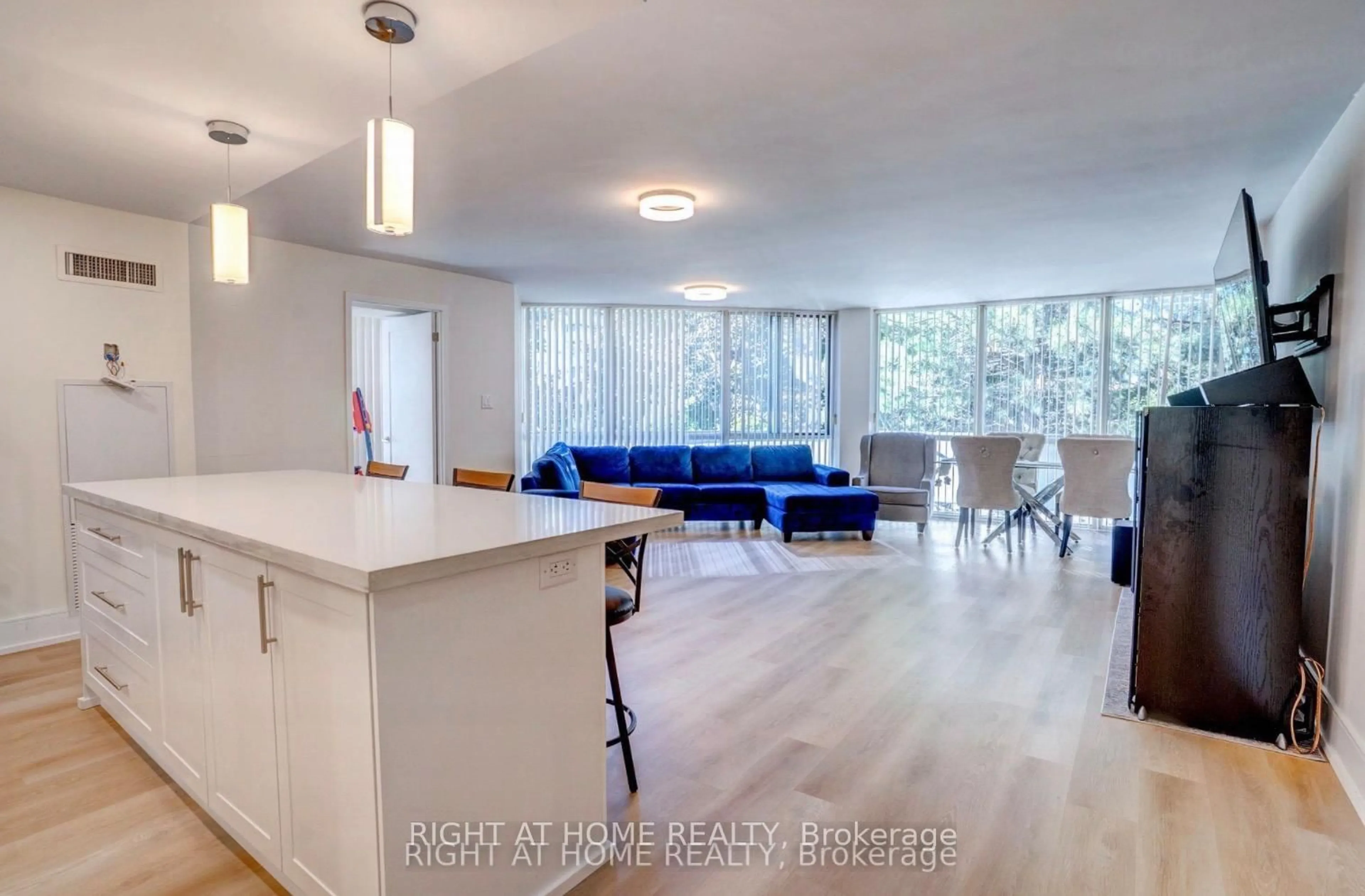 Open concept kitchen, wood/laminate floor for 350 Webb Dr #201, Mississauga Ontario L5B 3W4