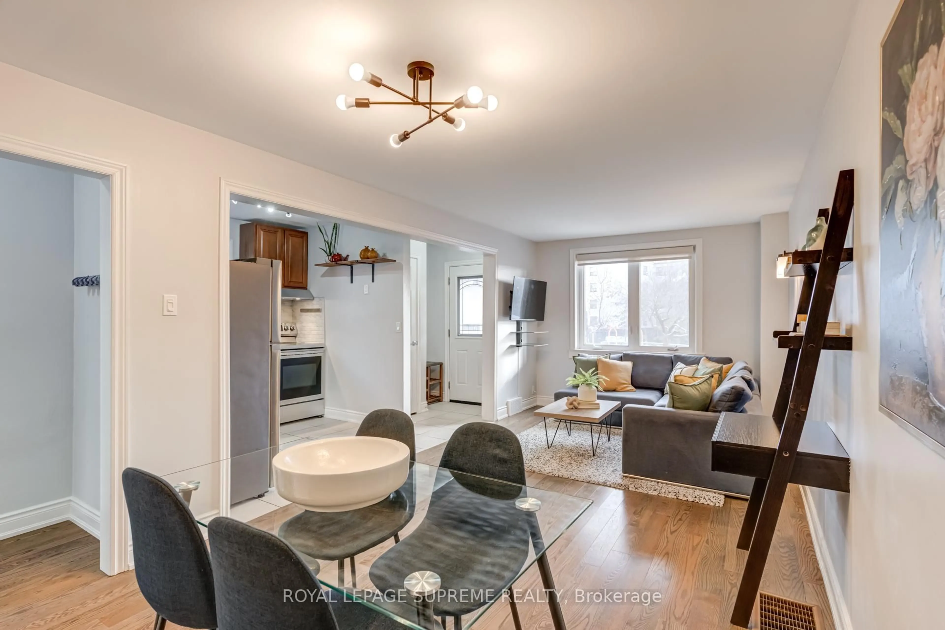 Living room with furniture, wood/laminate floor for 598 Ridelle Ave, Toronto Ontario M6B 1K9