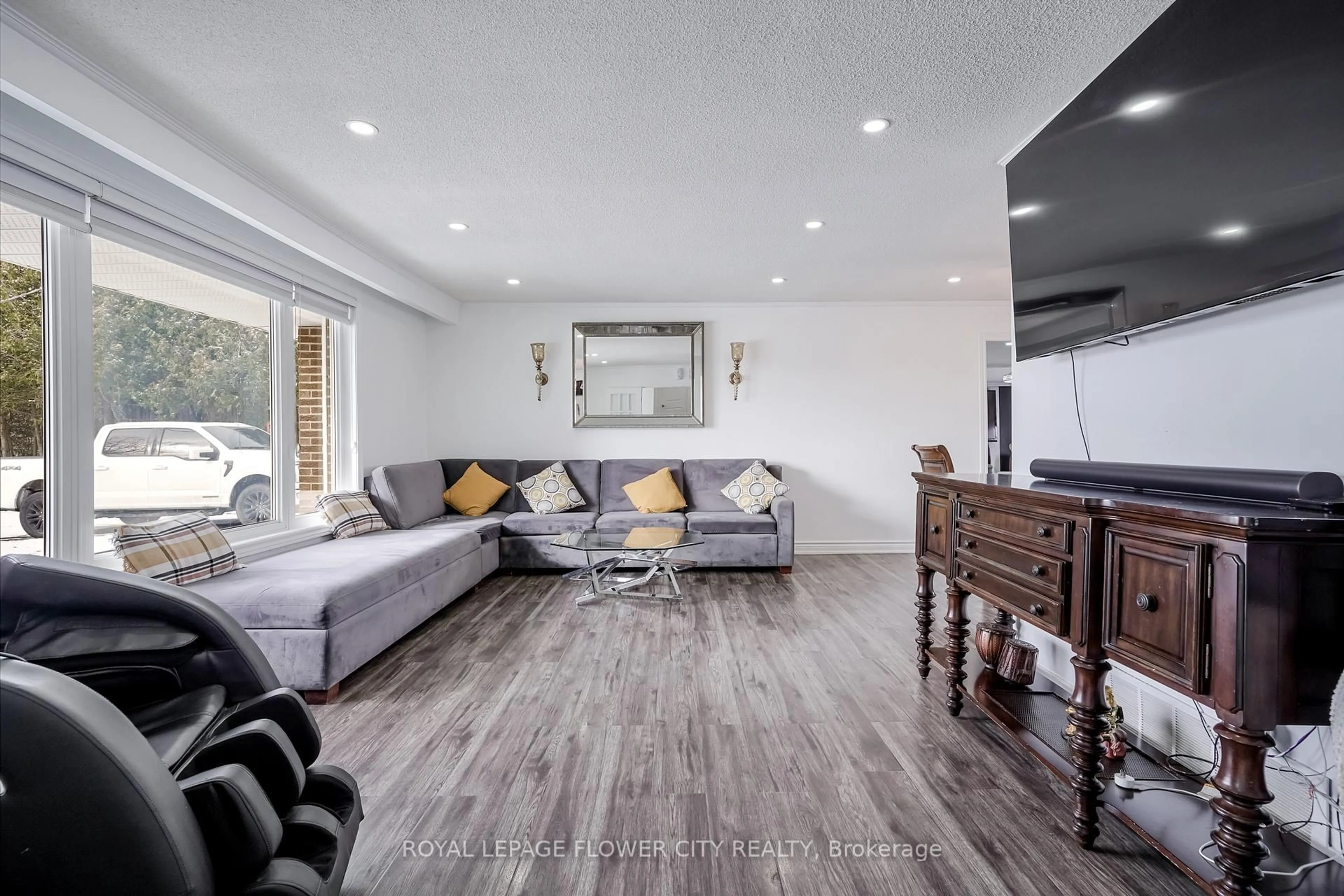 Living room with furniture, wood/laminate floor for 14073 CENTREVILLE CREEK Rd, Caledon Ontario L7C 3C1