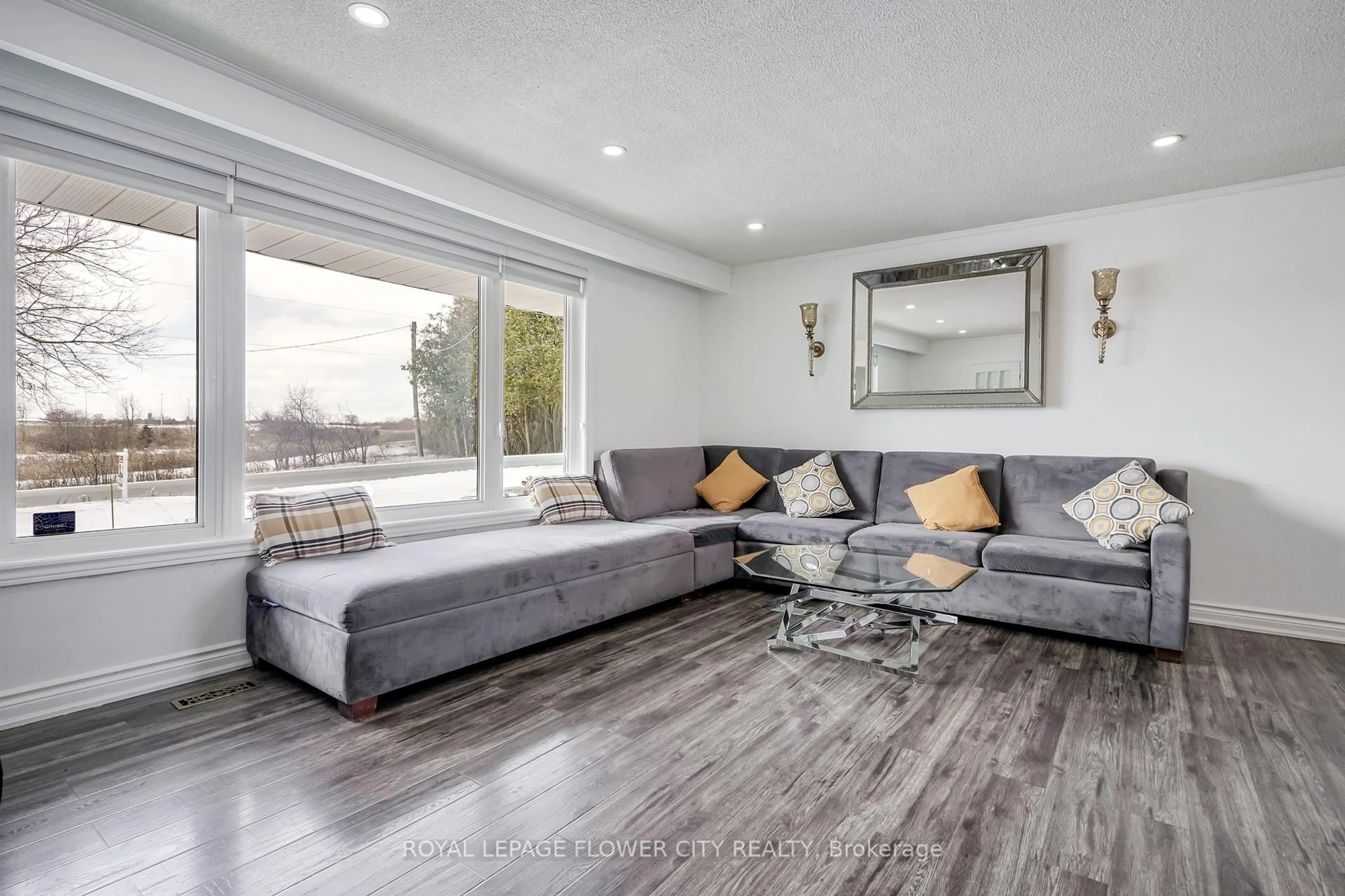 Living room with furniture, wood/laminate floor for 14073 CENTREVILLE CREEK Rd, Caledon Ontario L7C 3C1