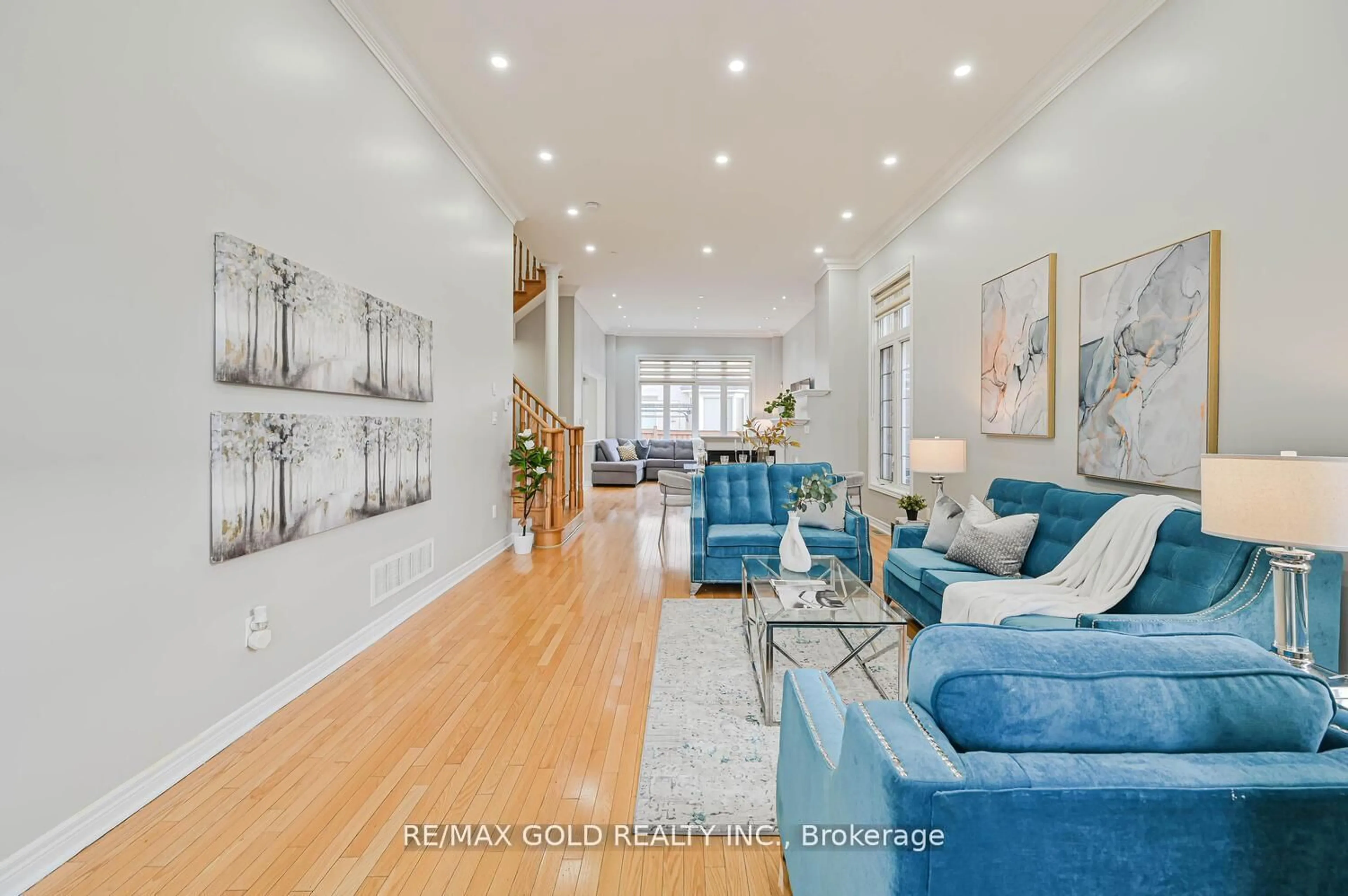 Living room with furniture, wood/laminate floor for 106 Watsonbrook Dr, Brampton Ontario L6R 0R4