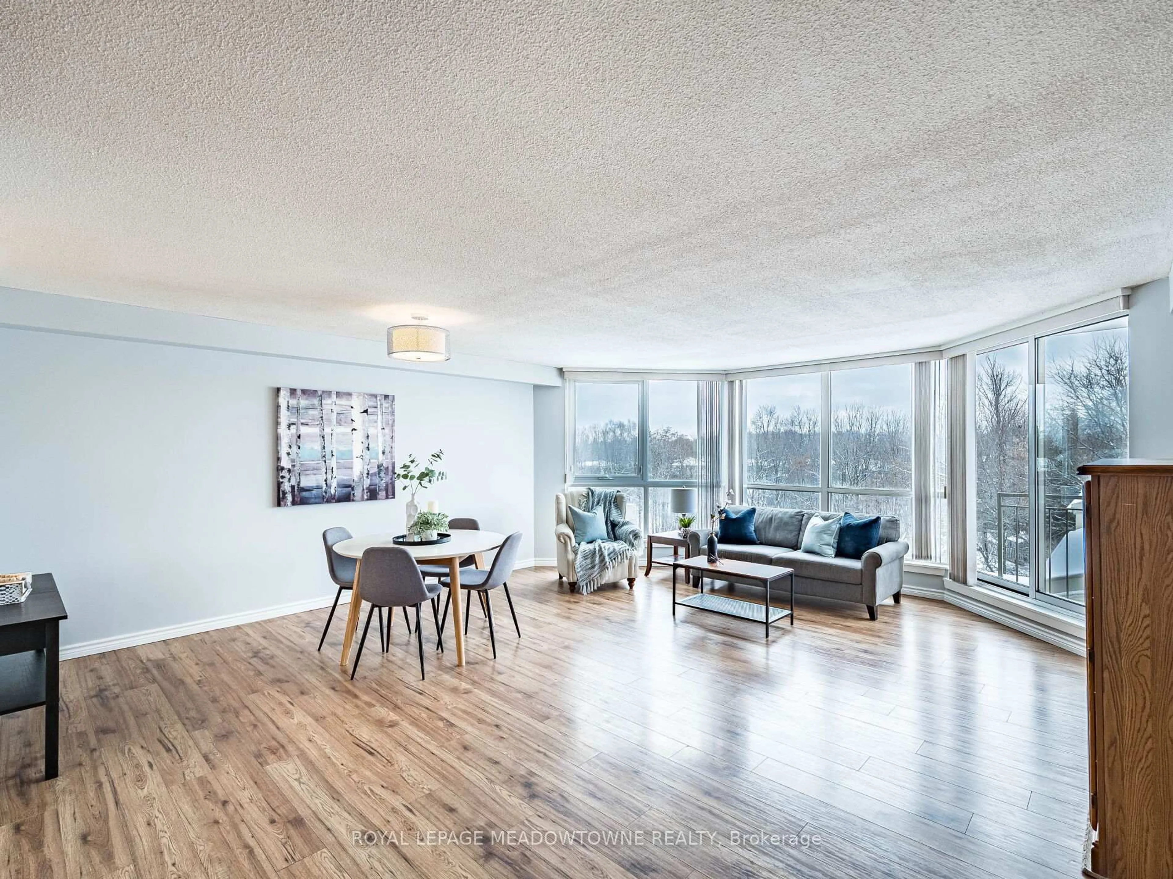 Living room with furniture, wood/laminate floor for 26 Hall Rd #306, Halton Hills Ontario L7G 5G5