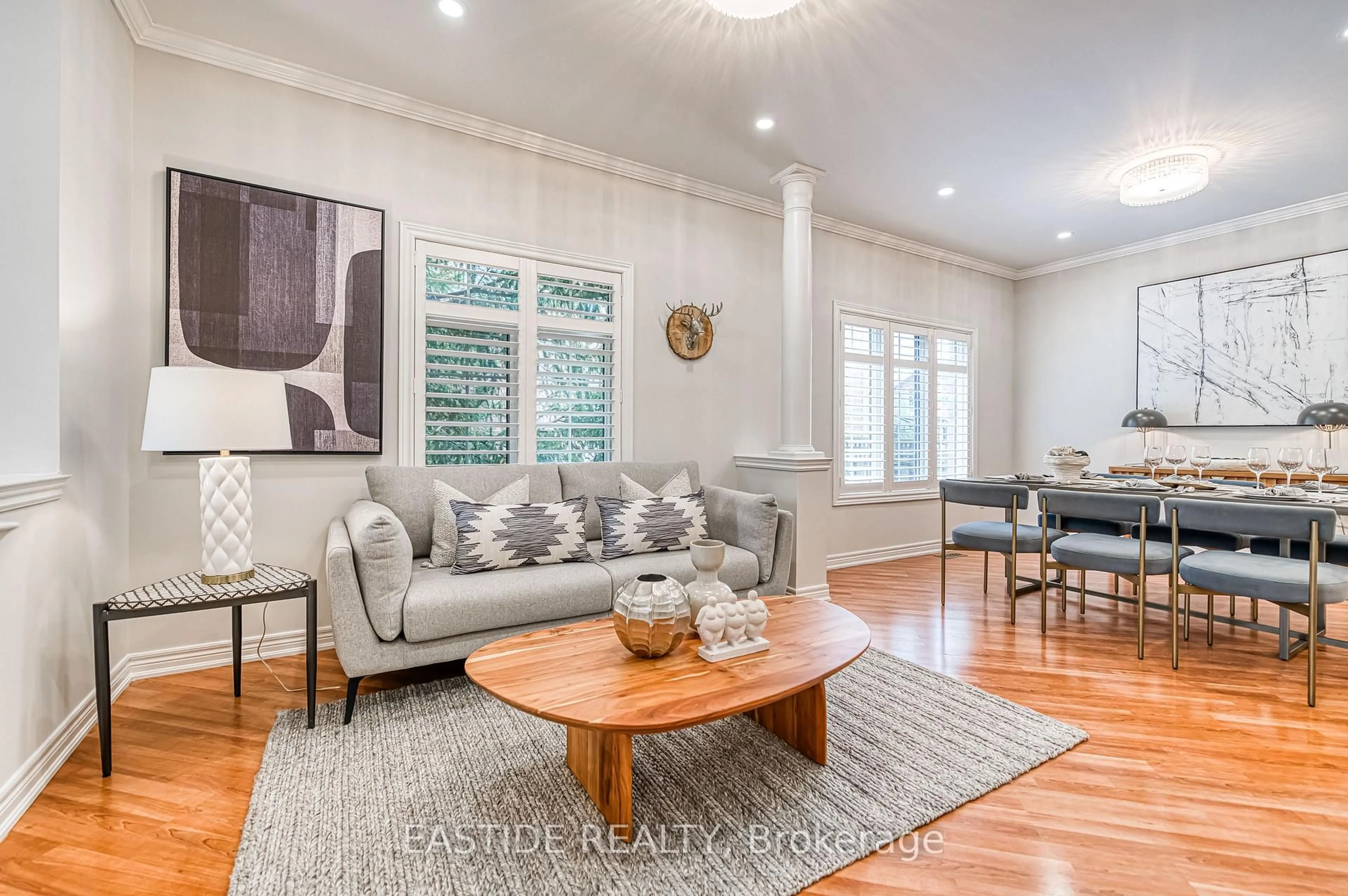 Living room with furniture, wood/laminate floor for 2422 Hertfordshire Way, Oakville Ontario L6H 7M5
