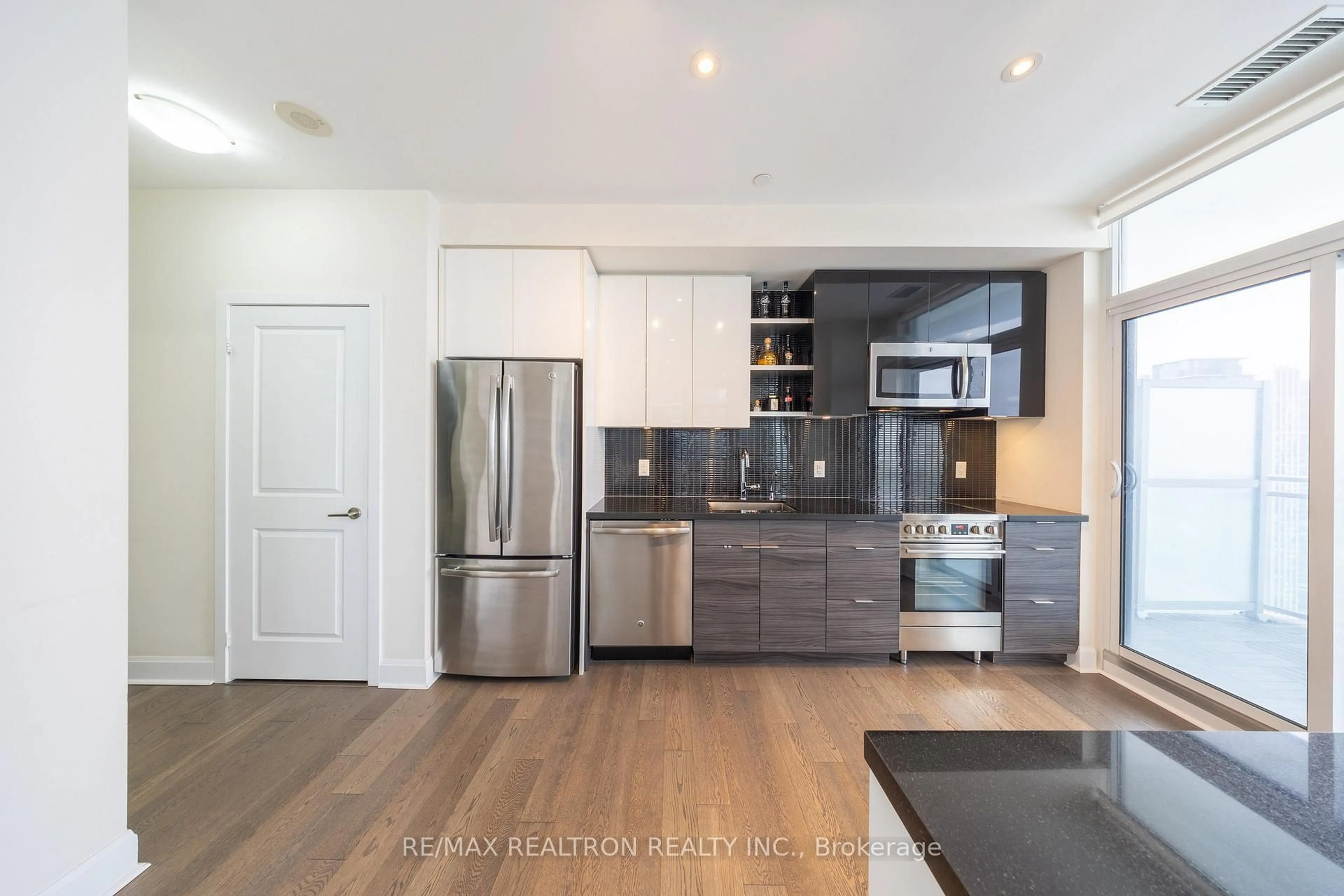 Open concept kitchen, wood/laminate floor for 33 Shore Breeze Dr #3404, Toronto Ontario M8V 0G1