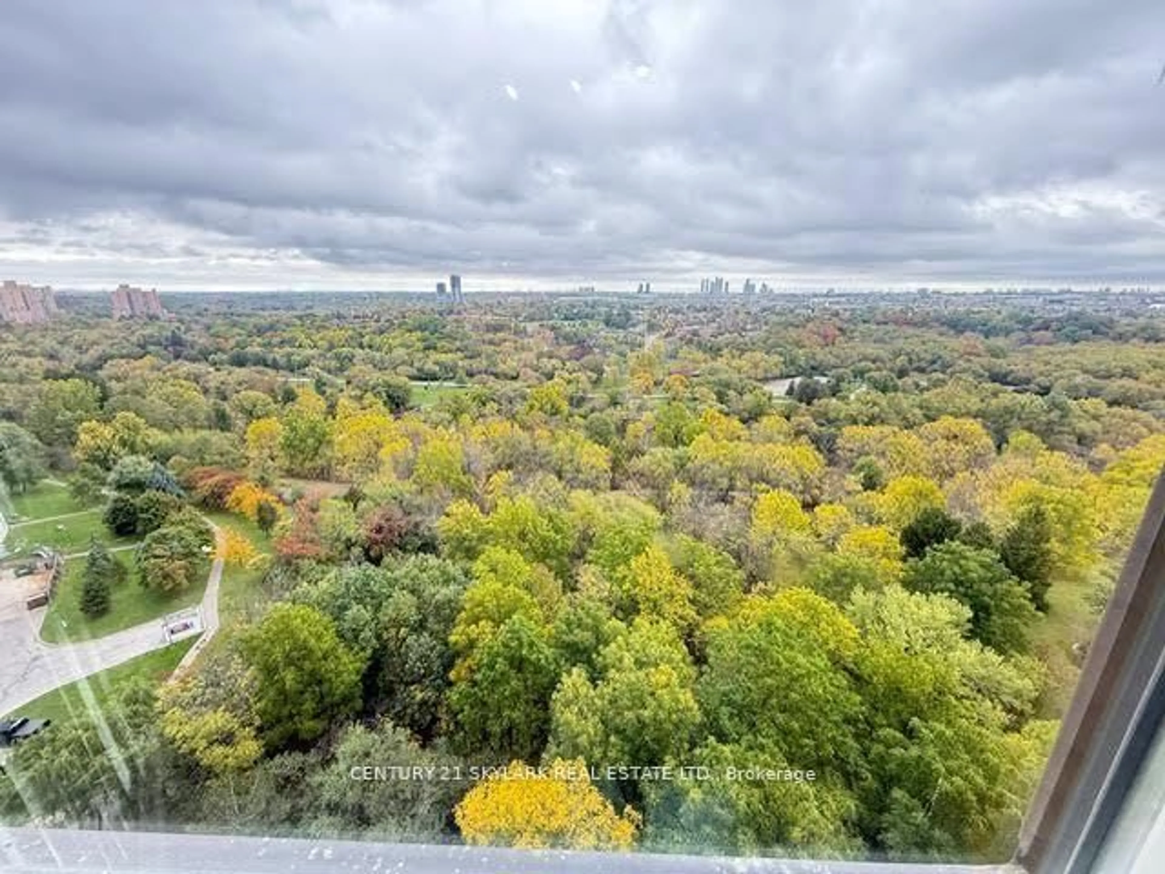 A pic from outside/outdoor area/front of a property/back of a property/a pic from drone, forest/trees view for 5 Rowntree Rd #1707, Toronto Ontario M9V 5G9