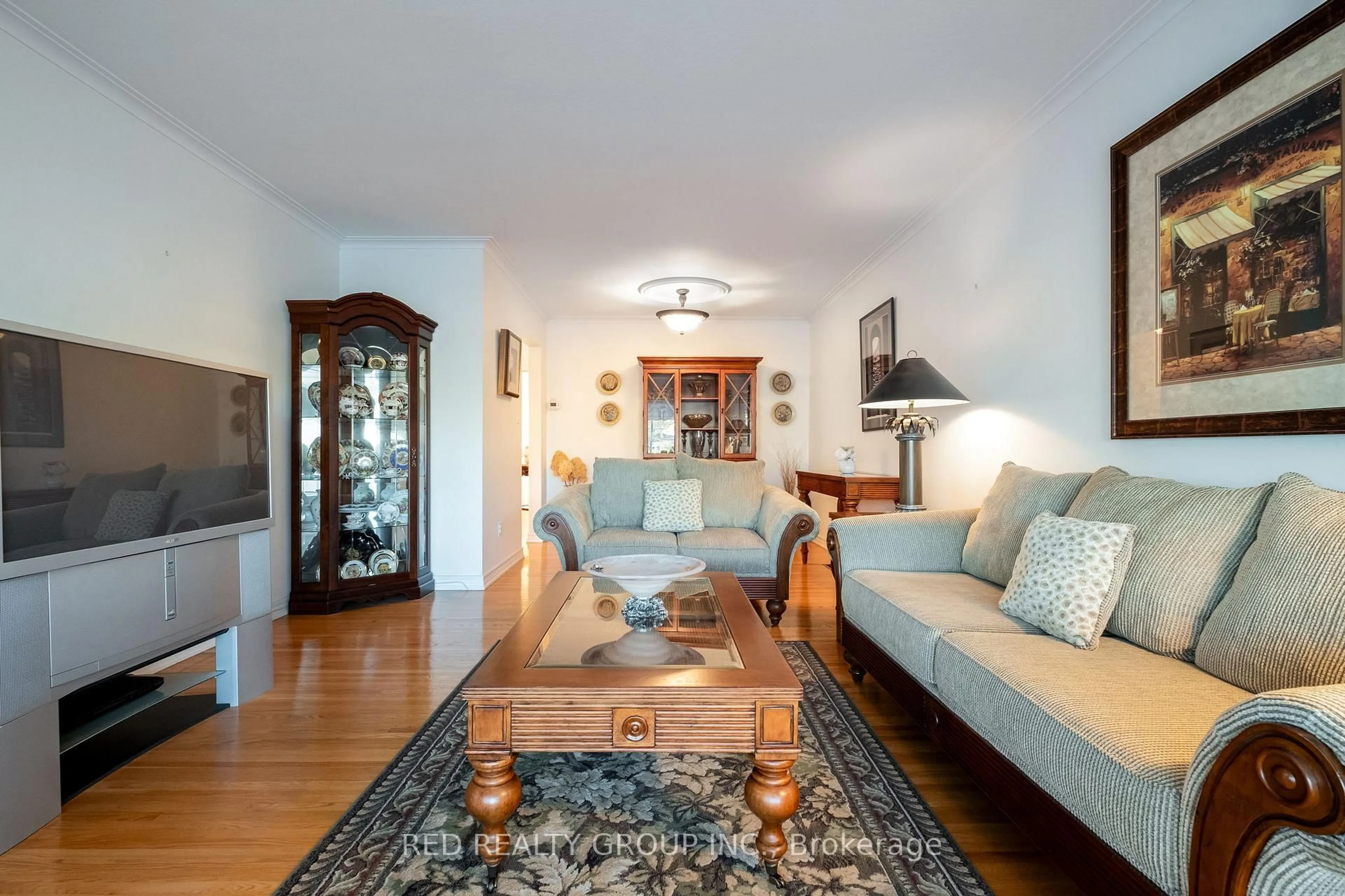 Living room with furniture, wood/laminate floor for 54 Buckland Rd, Toronto Ontario M3L 1W1