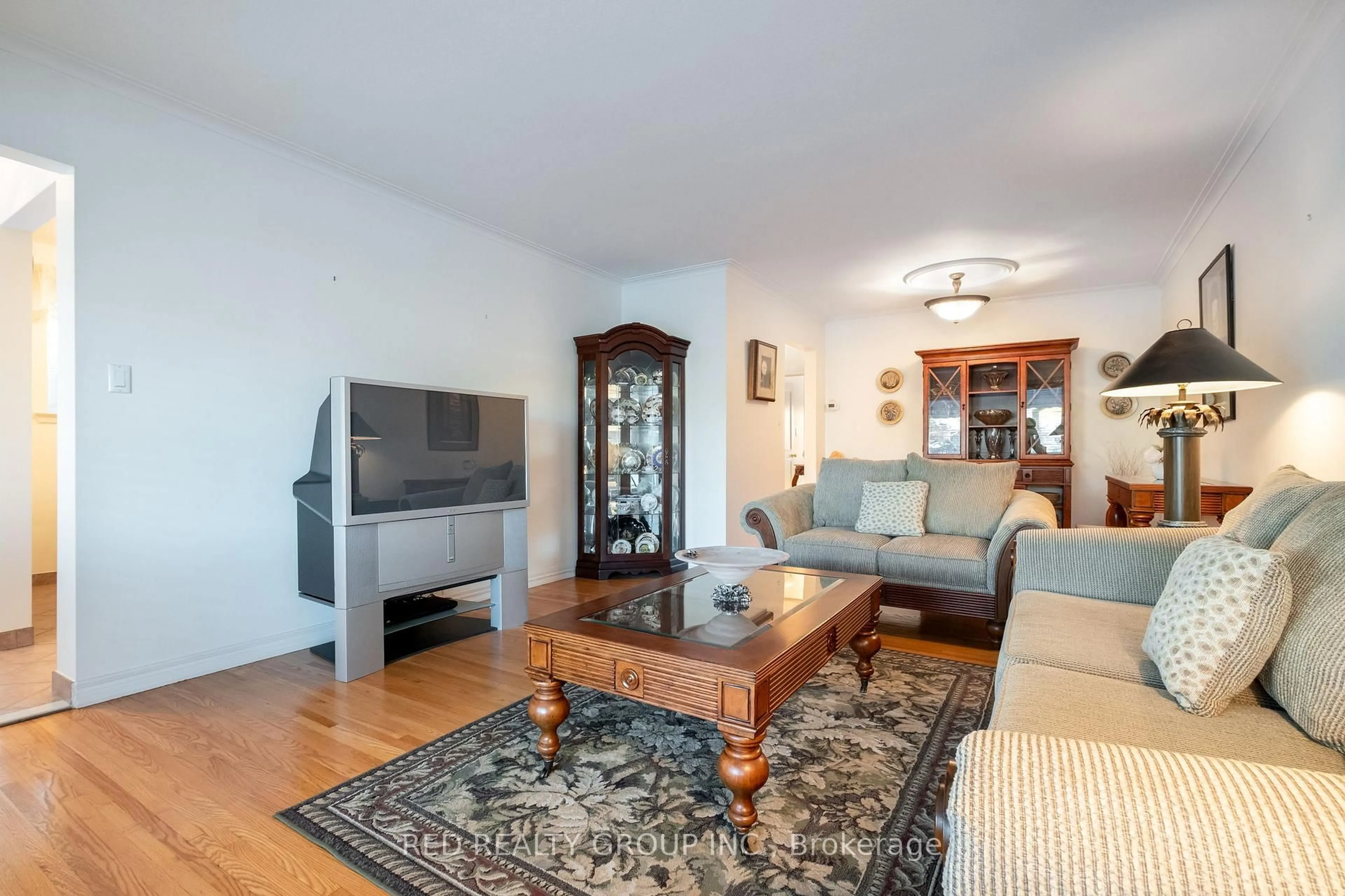 Living room with furniture, wood/laminate floor for 54 Buckland Rd, Toronto Ontario M3L 1W1