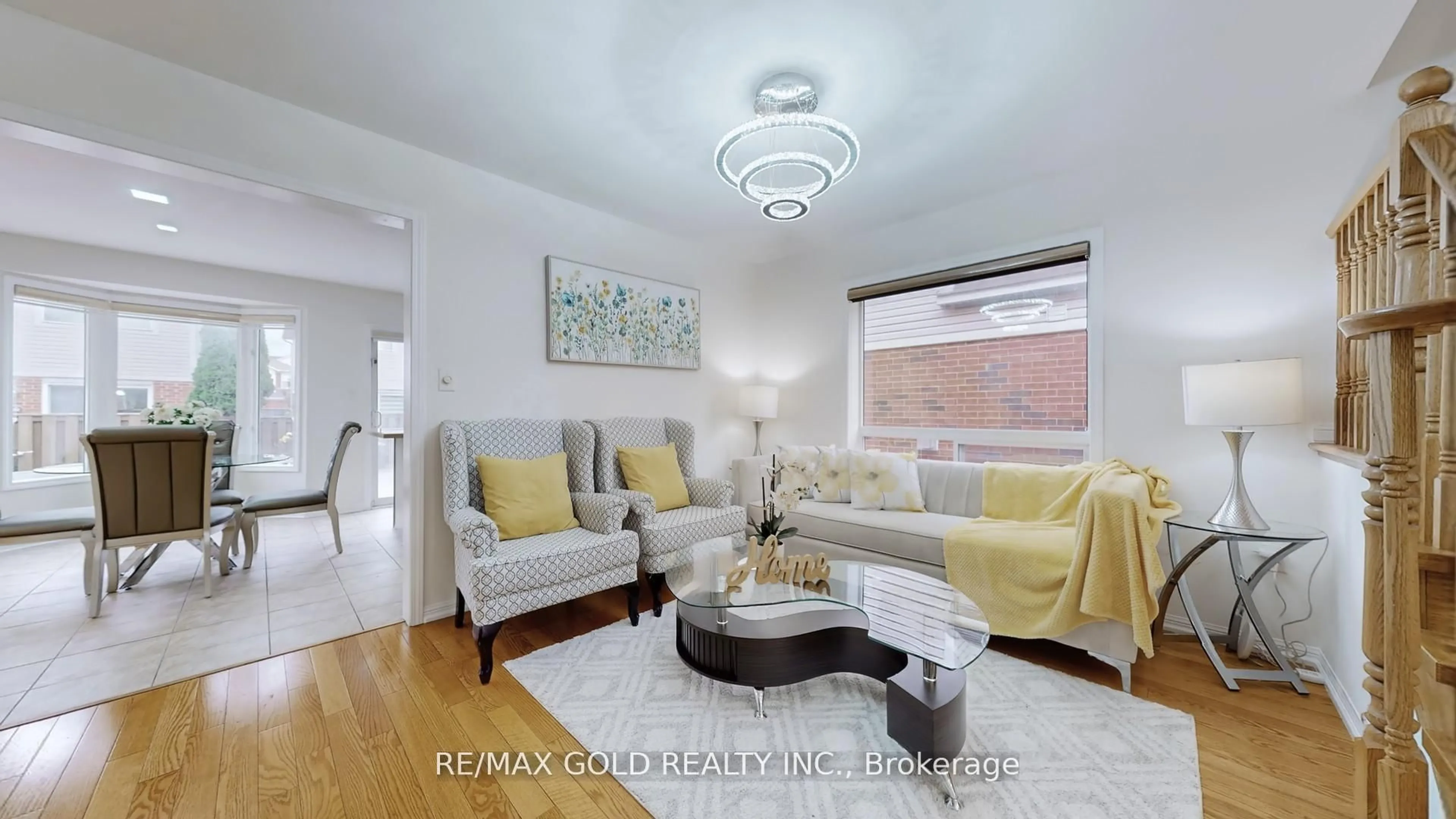 Living room with furniture, wood/laminate floor for 7 Chudleigh Ave, Brampton Ontario L6X 0N1