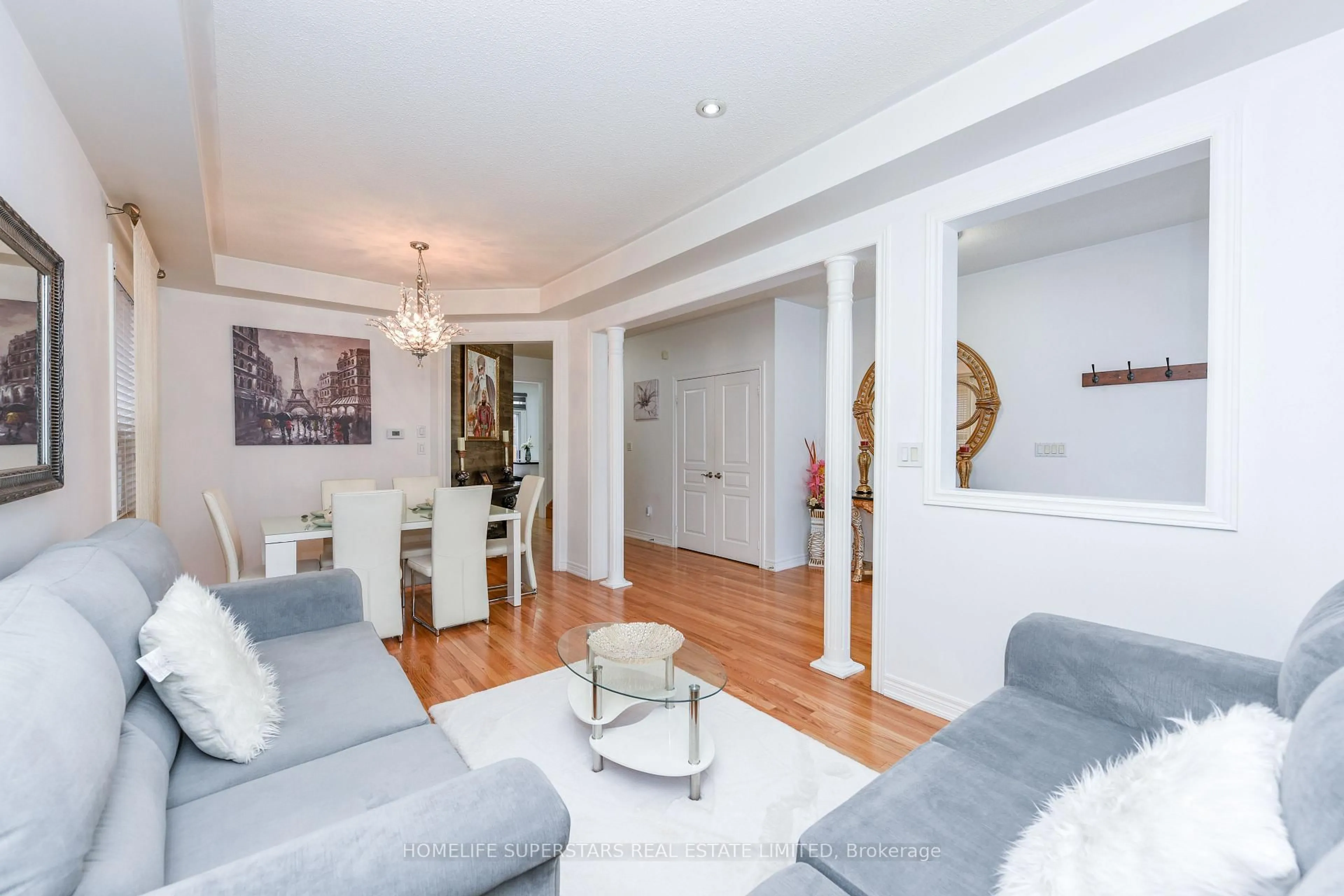 Living room with furniture, wood/laminate floor for 27 Dovehaven Cres, Brampton Ontario L6P 2N8