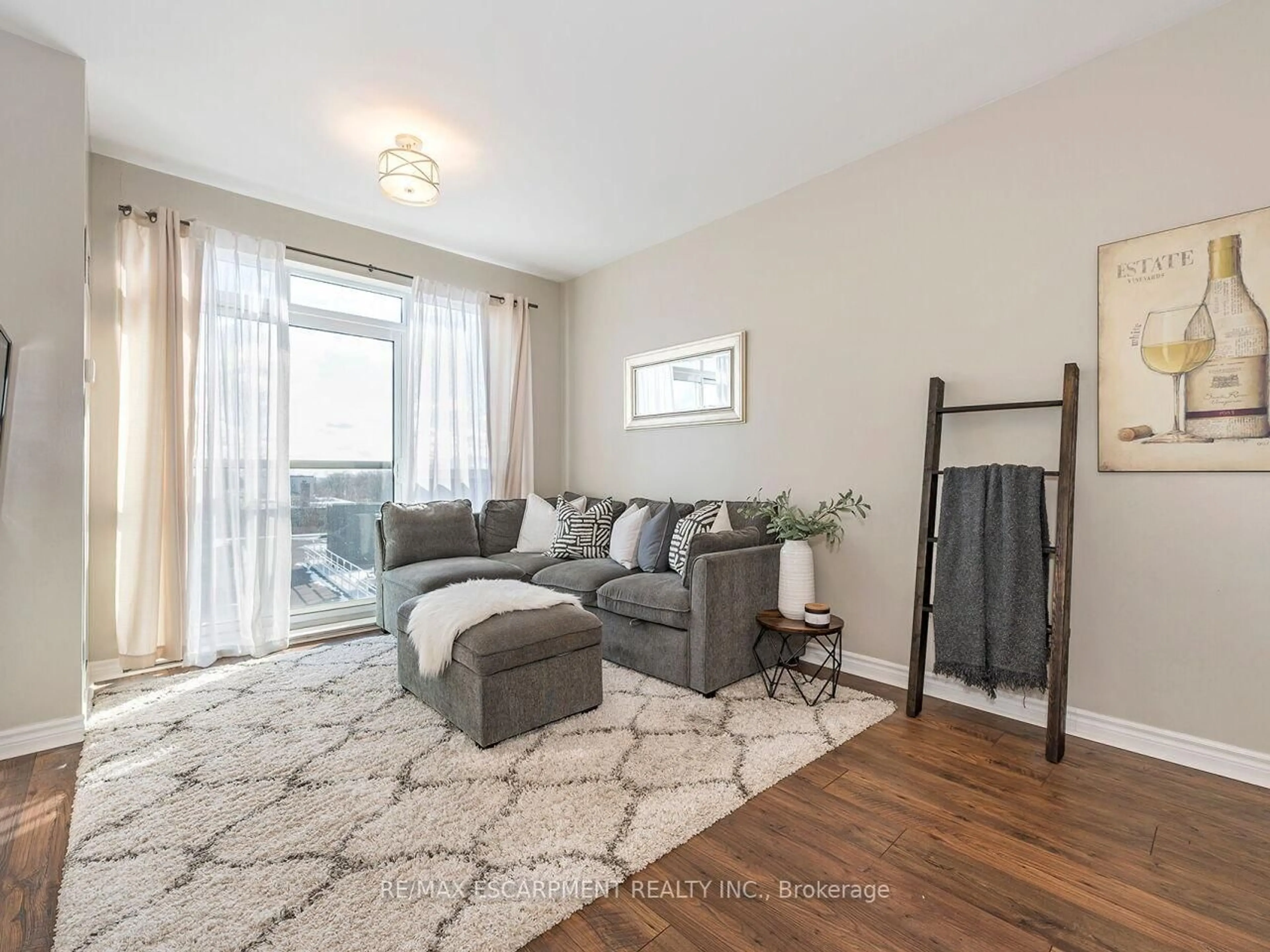 Living room with furniture, wood/laminate floor for 3865 Lake Shore Blvd #401, Toronto Ontario M8W 0A2