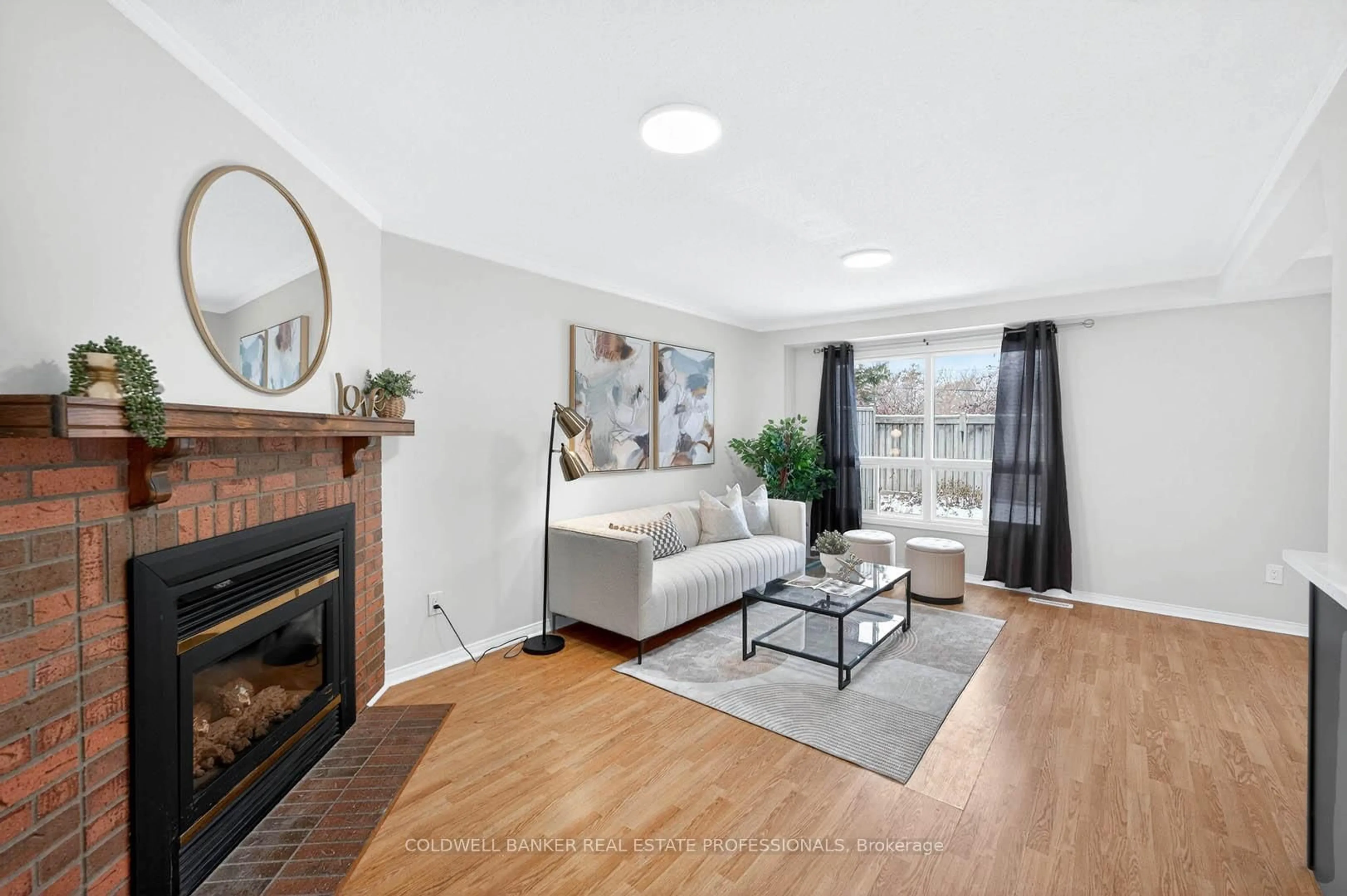 Living room with furniture, wood/laminate floor for 3510 South Millway #32, Mississauga Ontario L5L 3T9