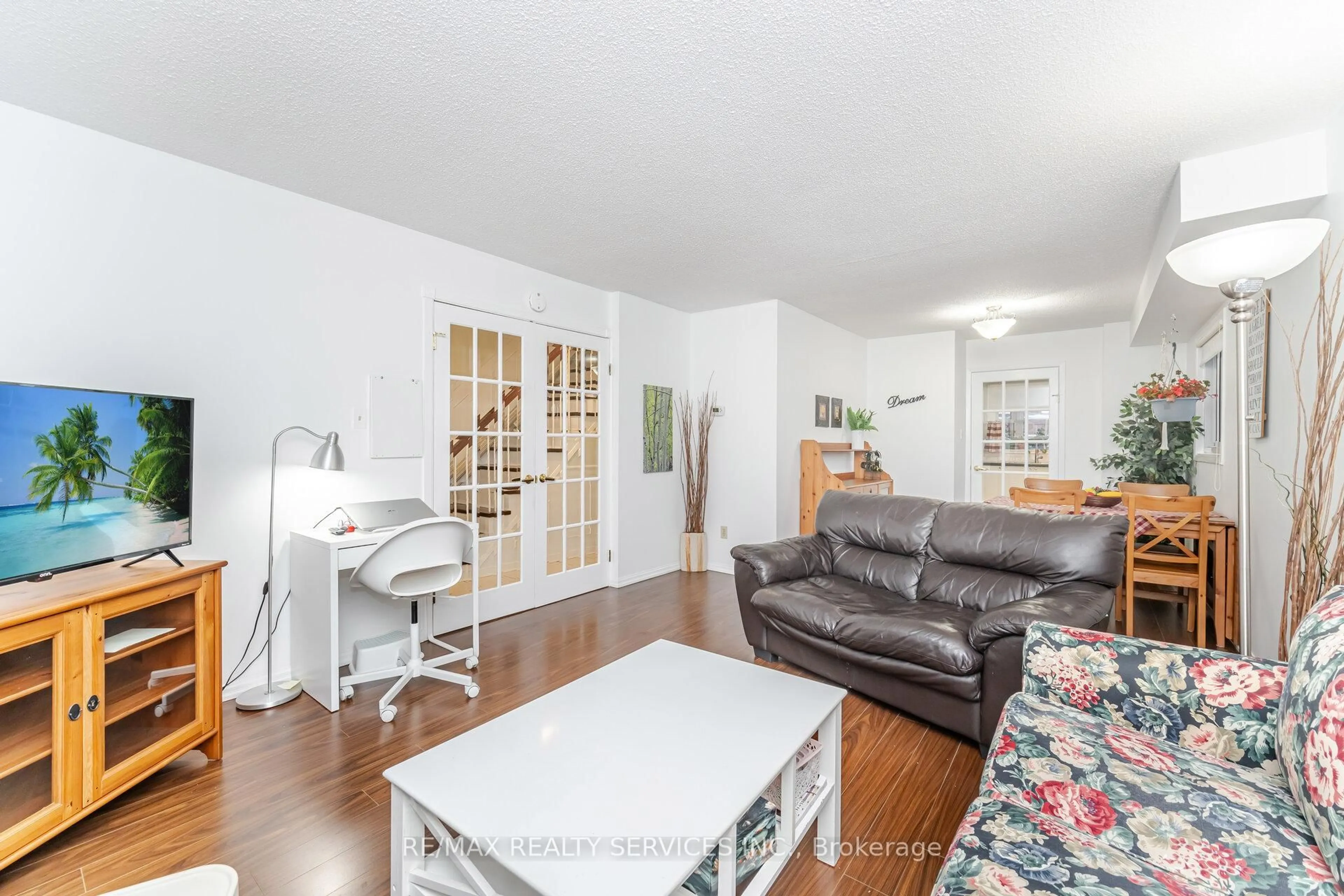 Living room with furniture, wood/laminate floor for 93 Wildercroft Ave, Brampton Ontario L6V 4G6