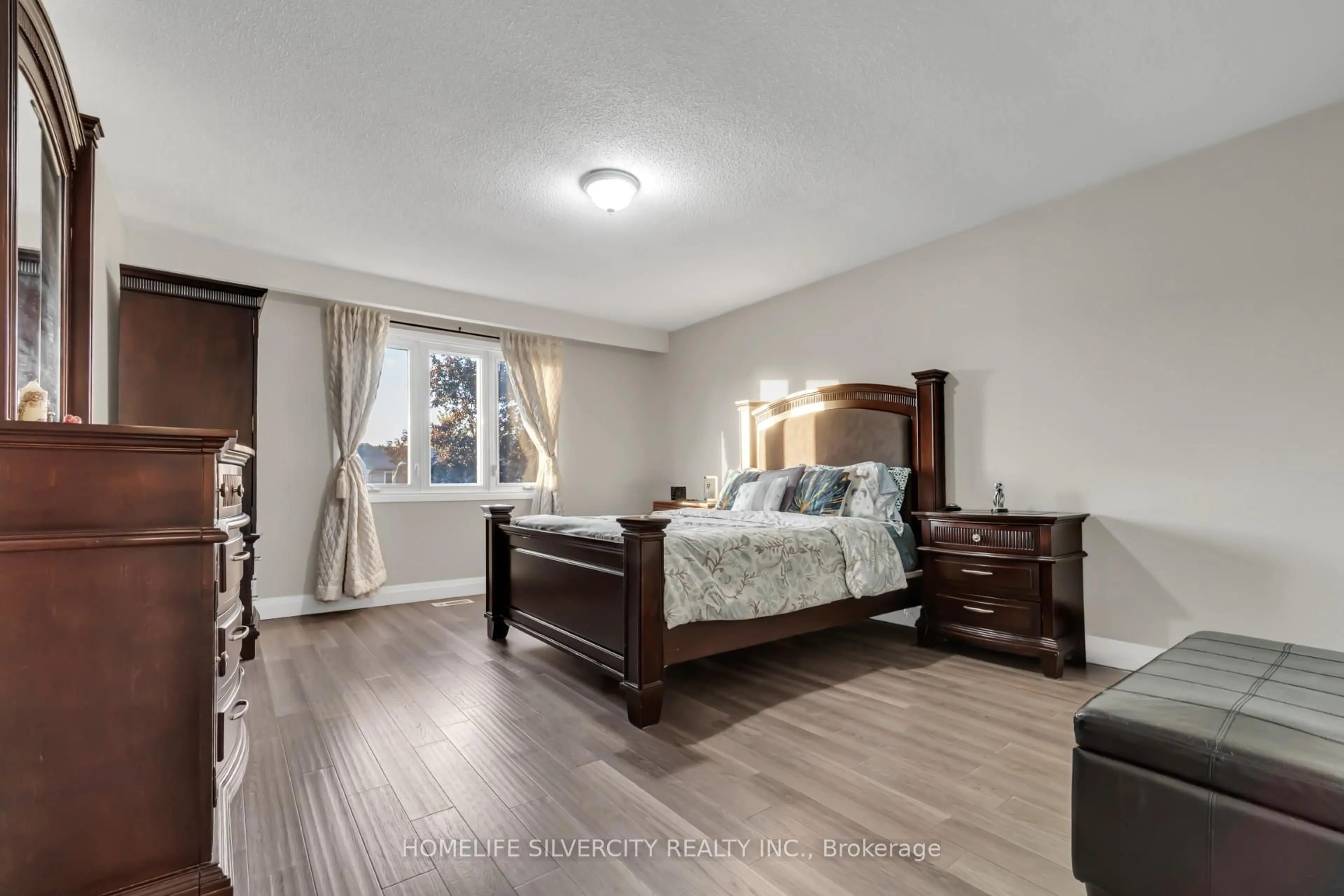 Bedroom with bed, wood/laminate floor for 29 Lindridge Ave, Brampton Ontario L6S 3W7