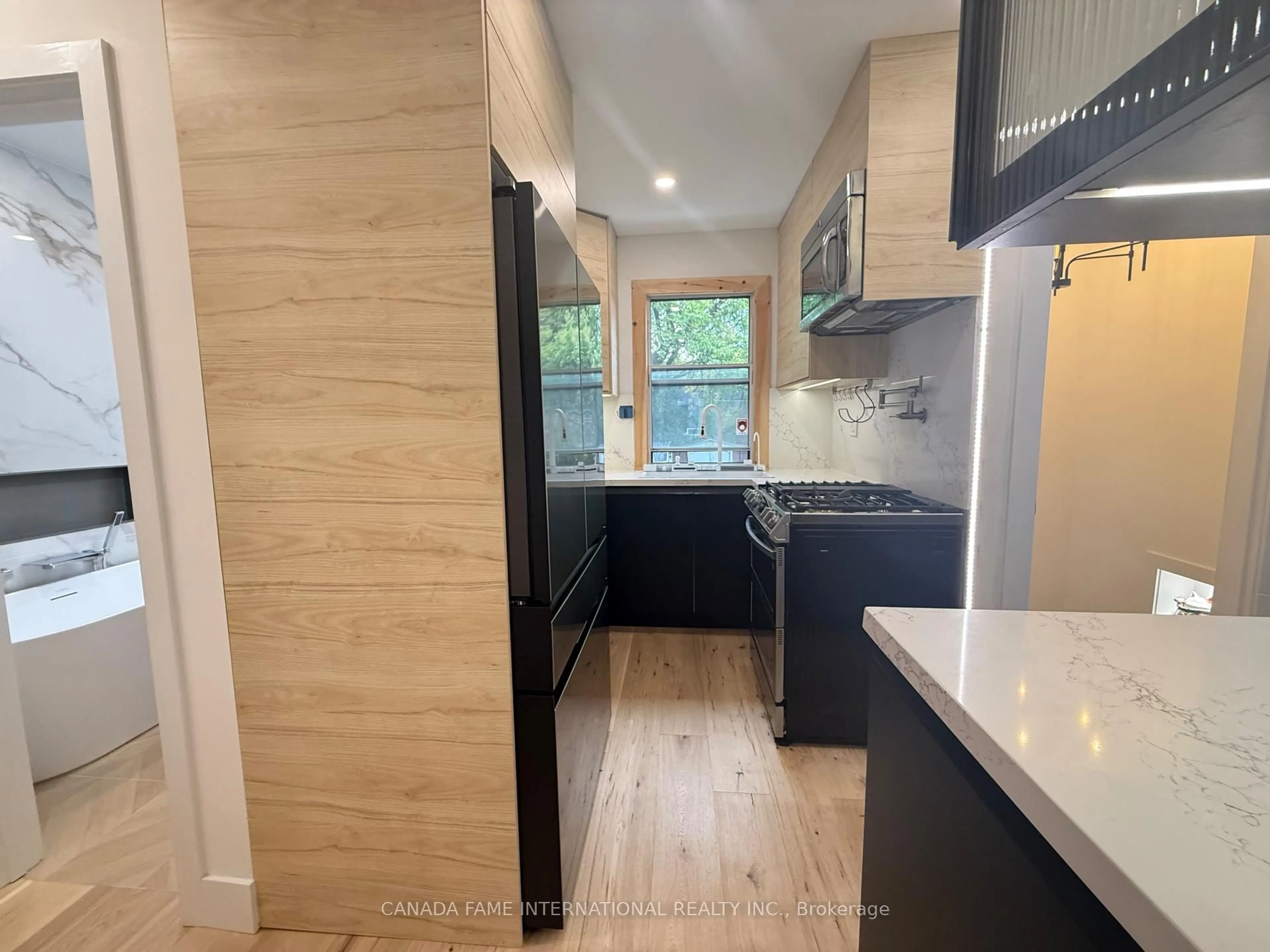 Open concept kitchen, wood/laminate floor for 1235 Glencairn Ave, Toronto Ontario M6B 2B6