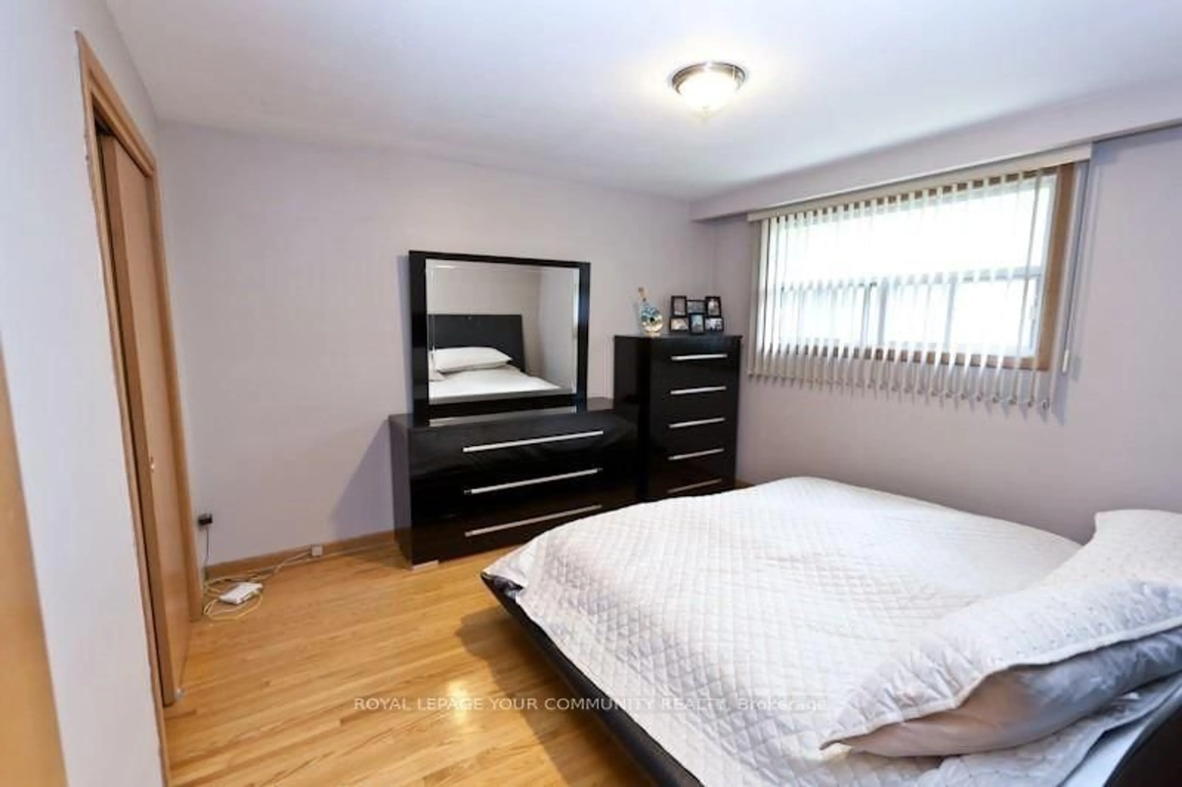 Bedroom with bed, wood/laminate floor for 8 Stanwood Cres, Toronto Ontario M9M 1Z9