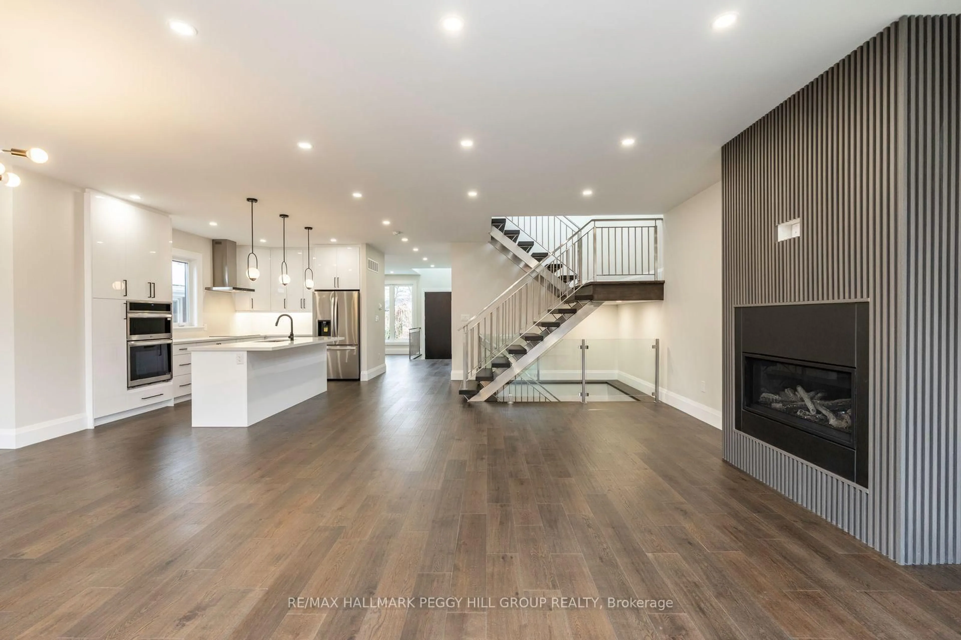 Open concept kitchen, wood/laminate floor for 18 Bellman Ave, Toronto Ontario M8W 4A3