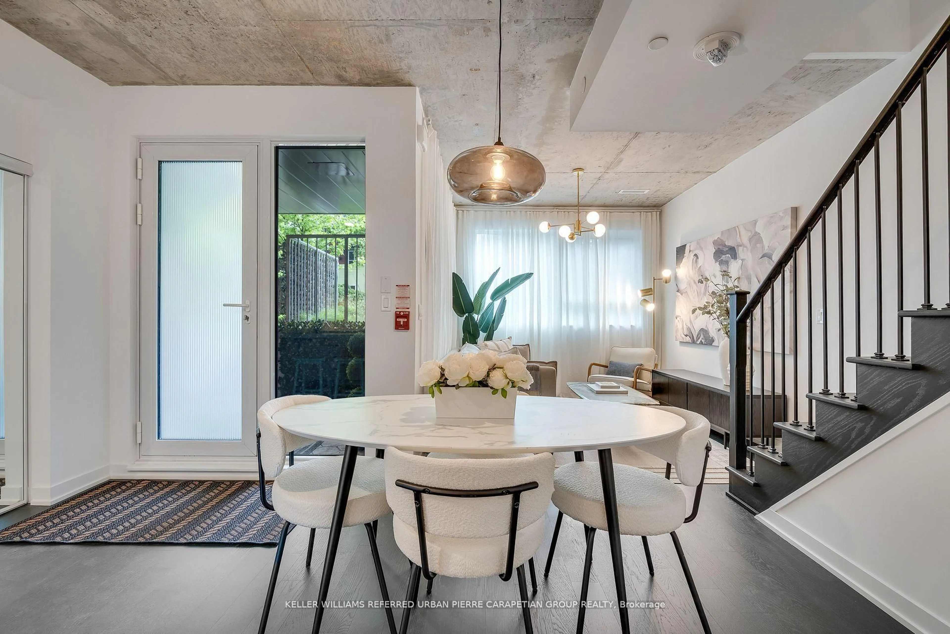 Dining room, cement floor for 57 Brock Ave #TH 109, Toronto Ontario M6K 0H3