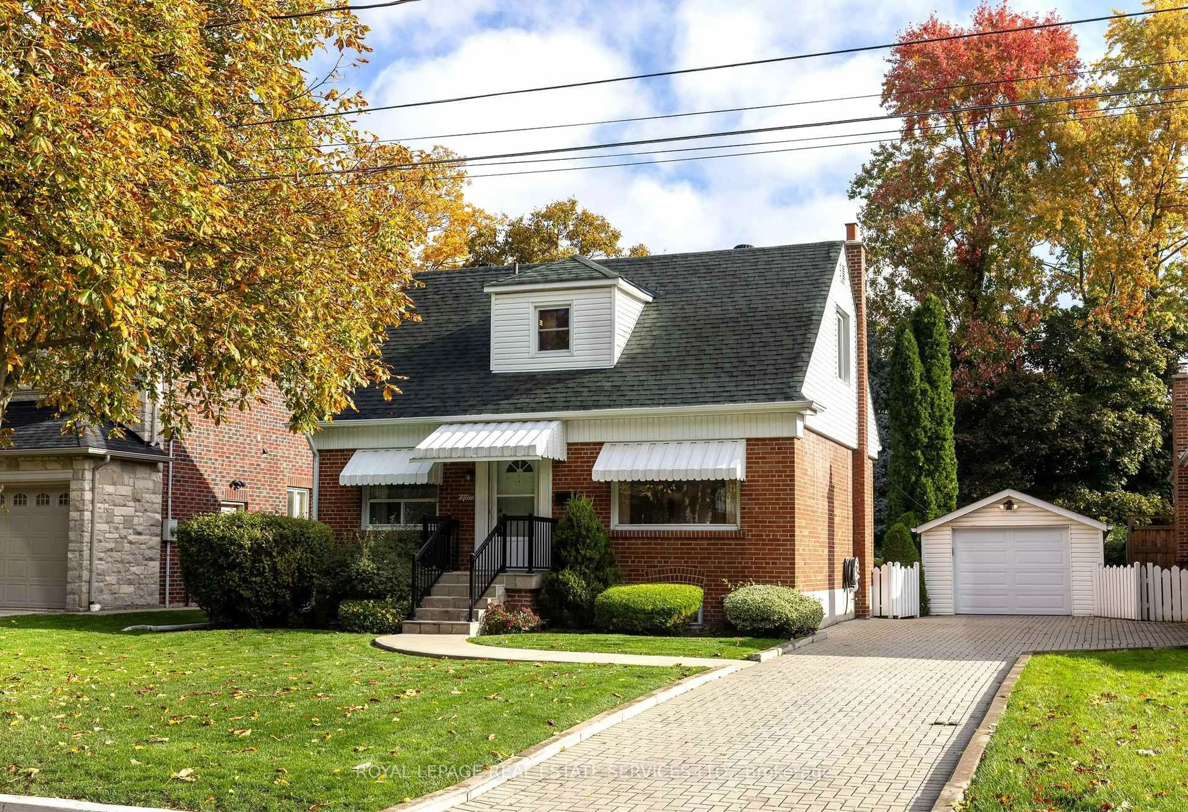 Home with brick exterior material, street for 15 Burnelm Dr, Toronto Ontario M9B 4N2