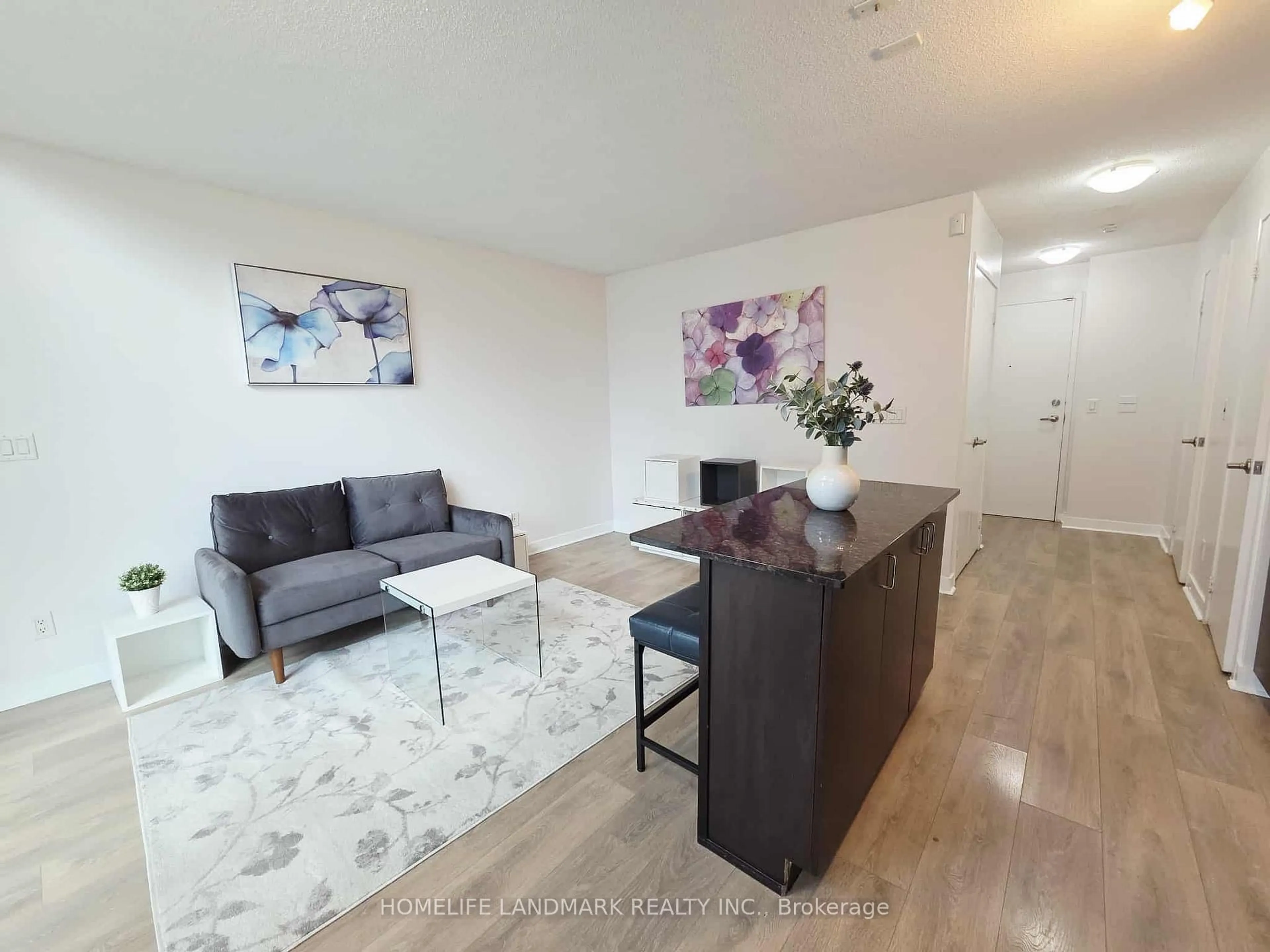 Living room with furniture, wood/laminate floor for 155 Legion Rd #1706, Toronto Ontario M8Y 0A7