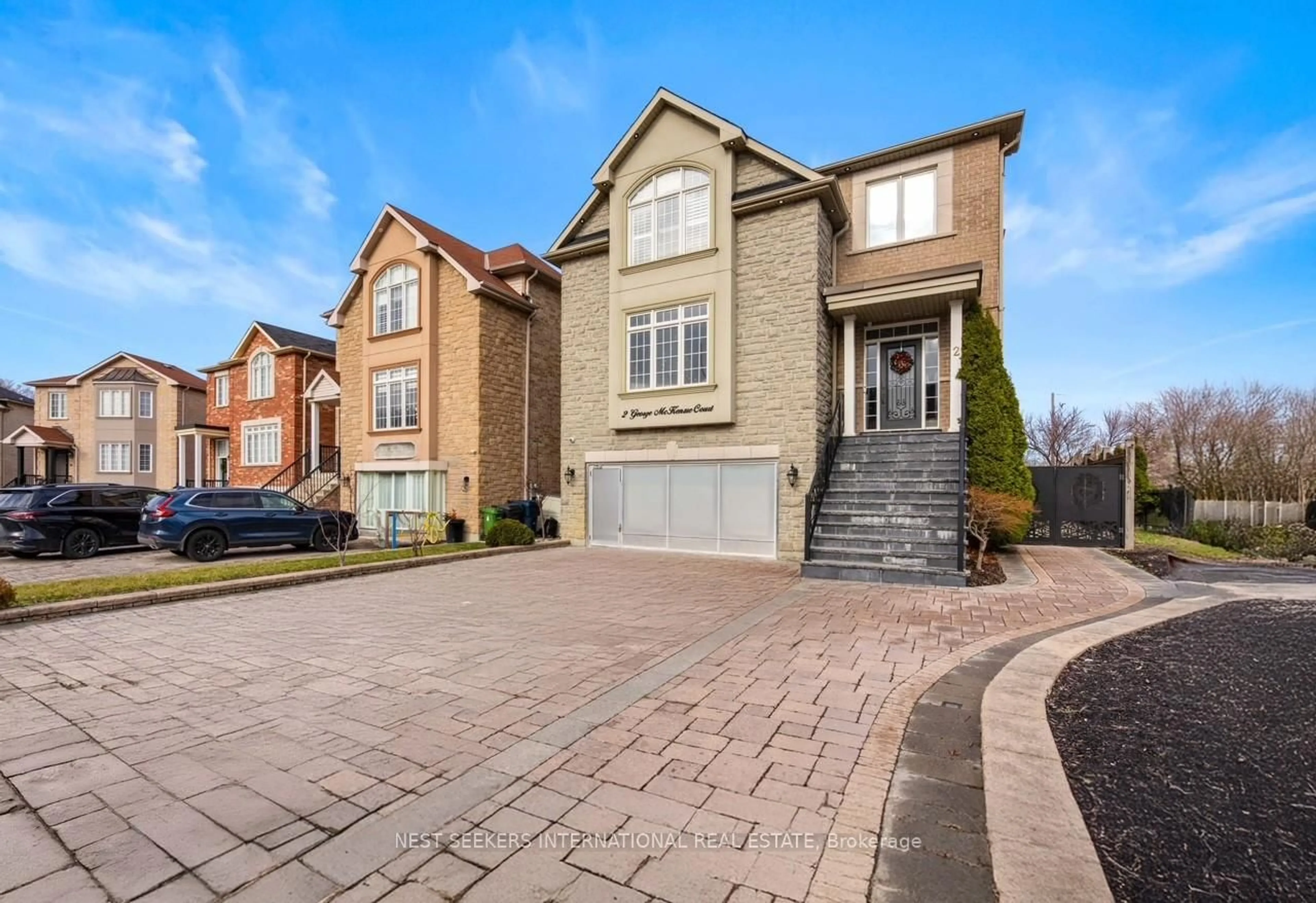 Home with brick exterior material, street for 2 George McKenzie Crt, Toronto Ontario M9M 0E1