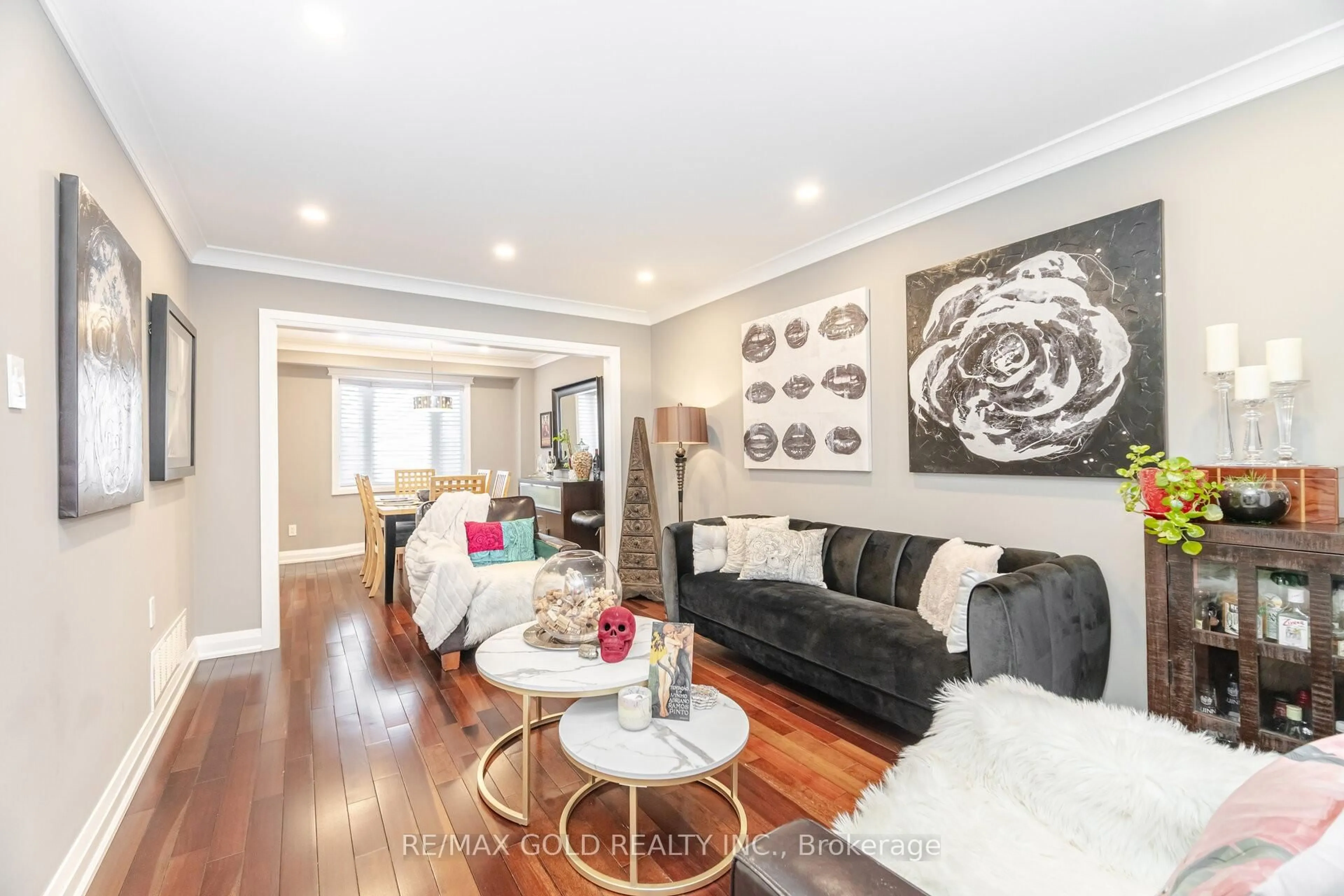 Living room with furniture, wood/laminate floor for 62 Oleander Cres, Brampton Ontario L6Z 2C2