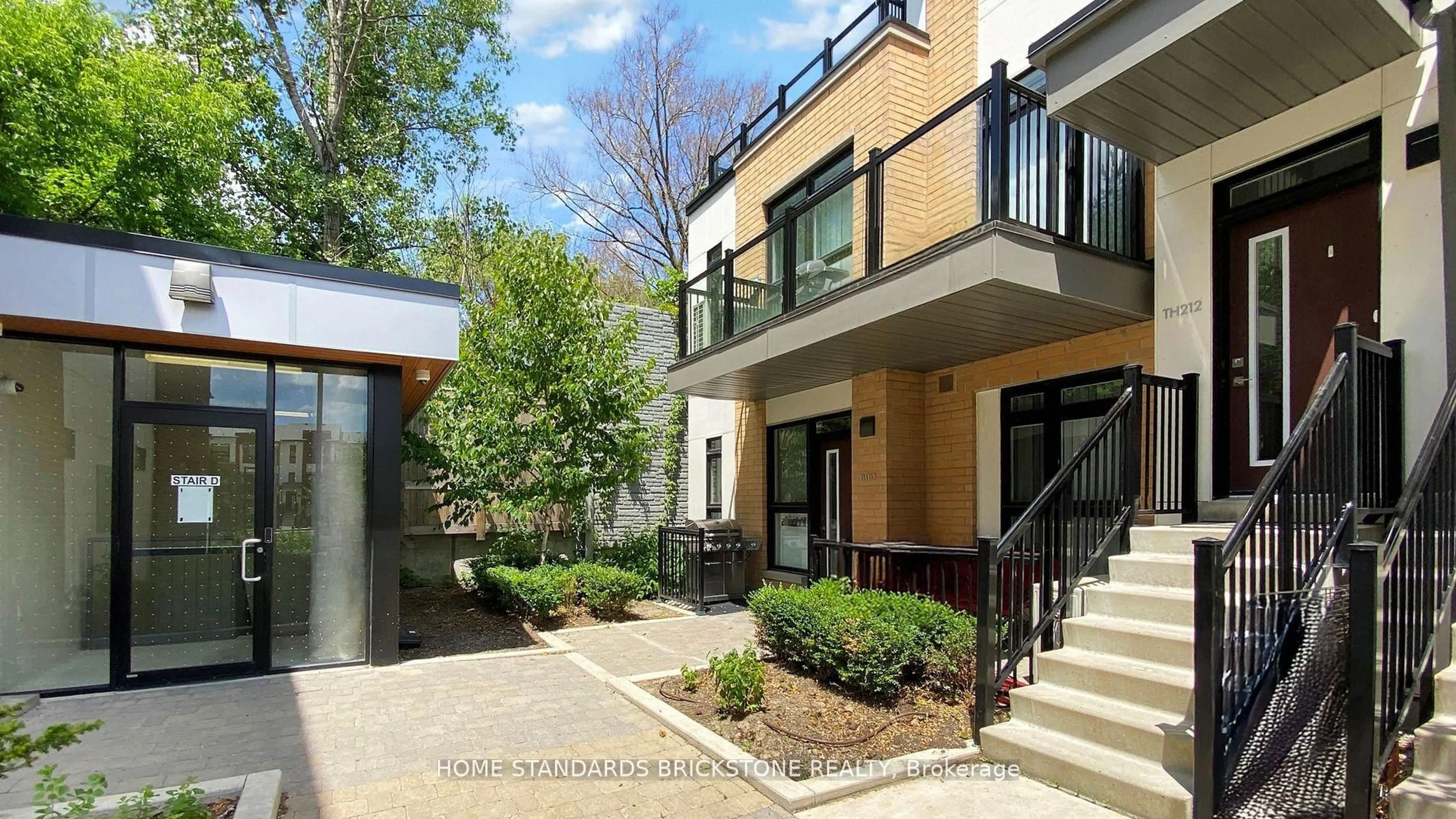 Home with brick exterior material, street for 90 Canon Jackson Dr #H212, Toronto Ontario M6M 0C1