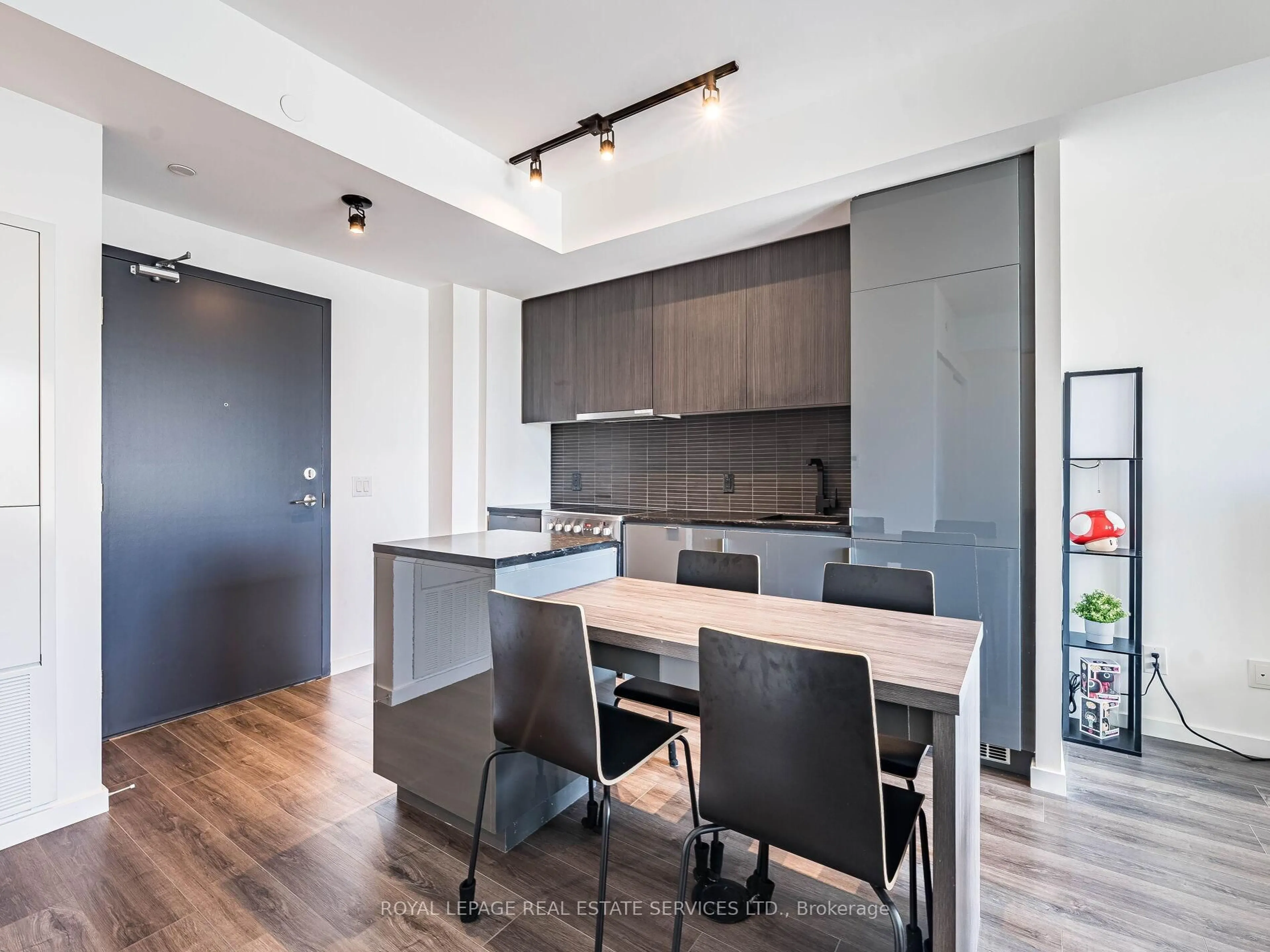 Open concept kitchen, wood/laminate floor for 7 Smith Cres #312, Toronto Ontario M8Z 0Z3