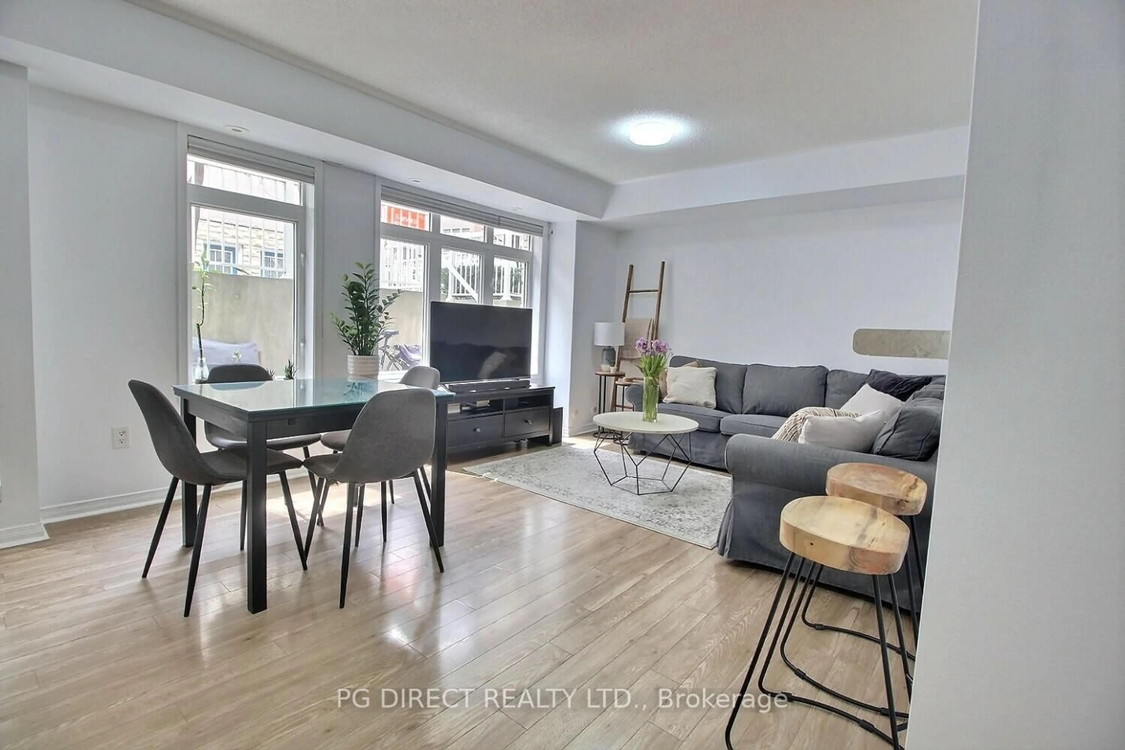 Living room with furniture, unknown for 50 Turntable Cres #57, Toronto Ontario M6H 4K9