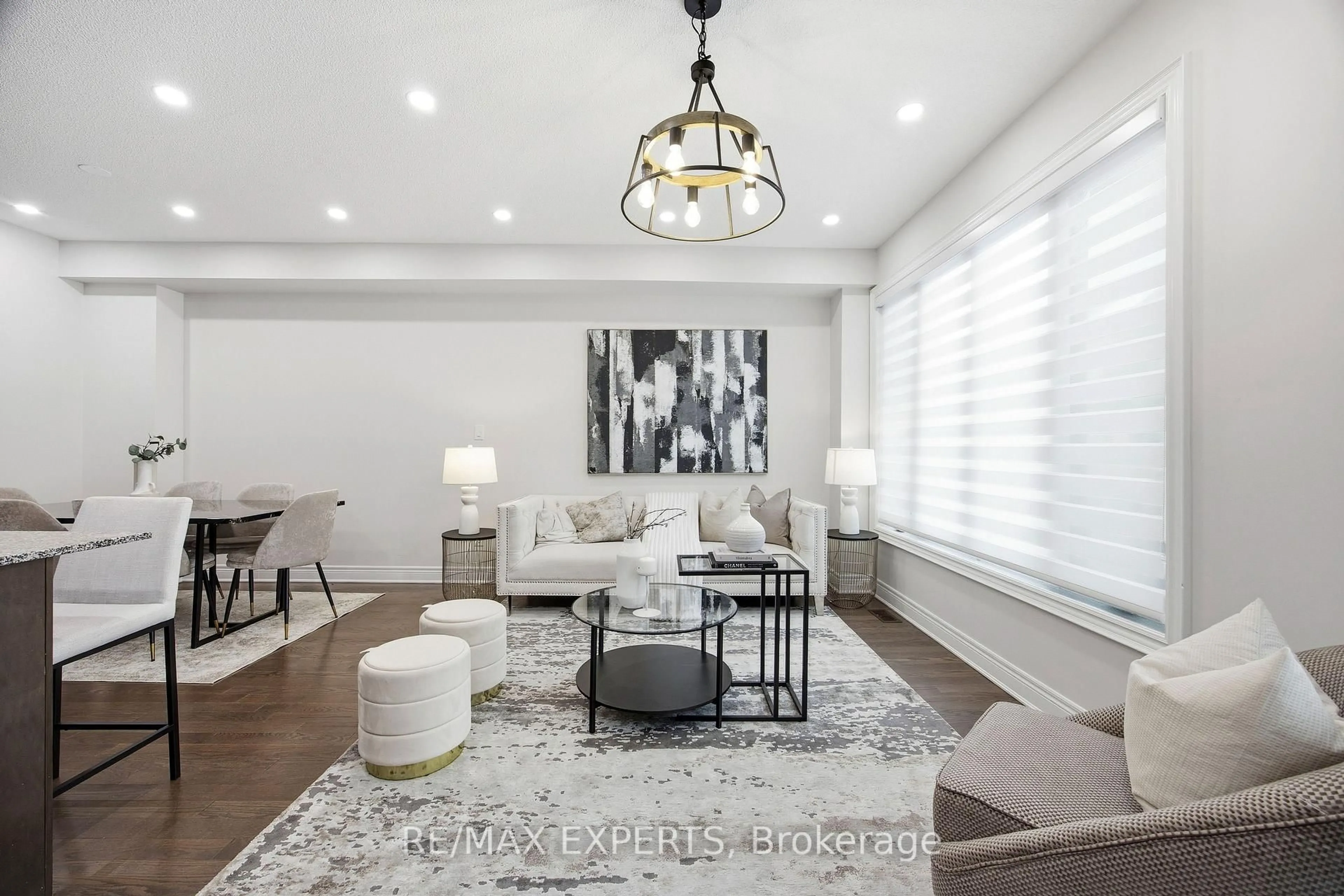 Living room with furniture, wood/laminate floor for 1328 Restivo Lane, Milton Ontario L9E 1J9