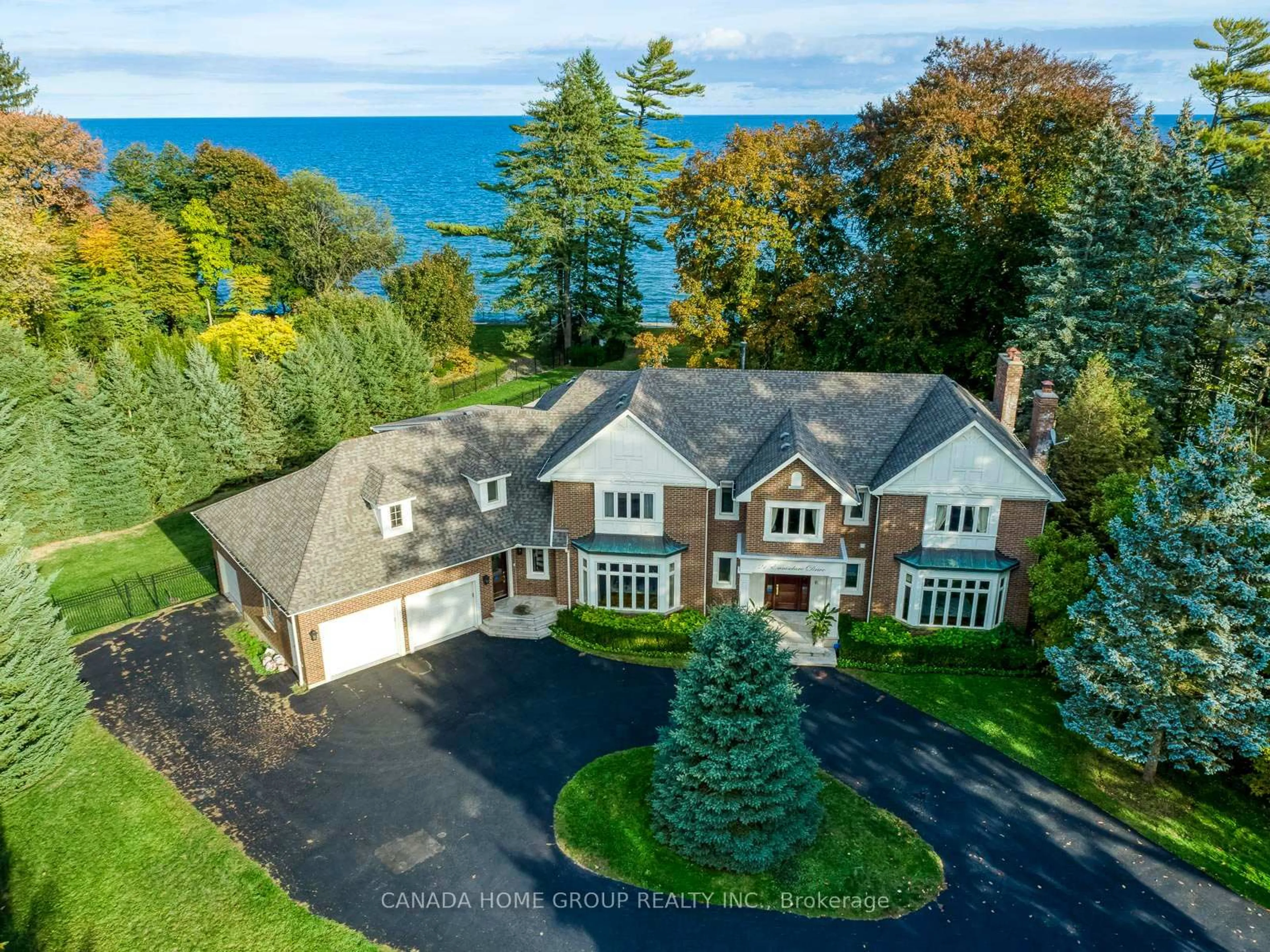 A pic from outside/outdoor area/front of a property/back of a property/a pic from drone, water/lake/river/ocean view for 21 Ennisclare Dr, Oakville Ontario L6J 4N3