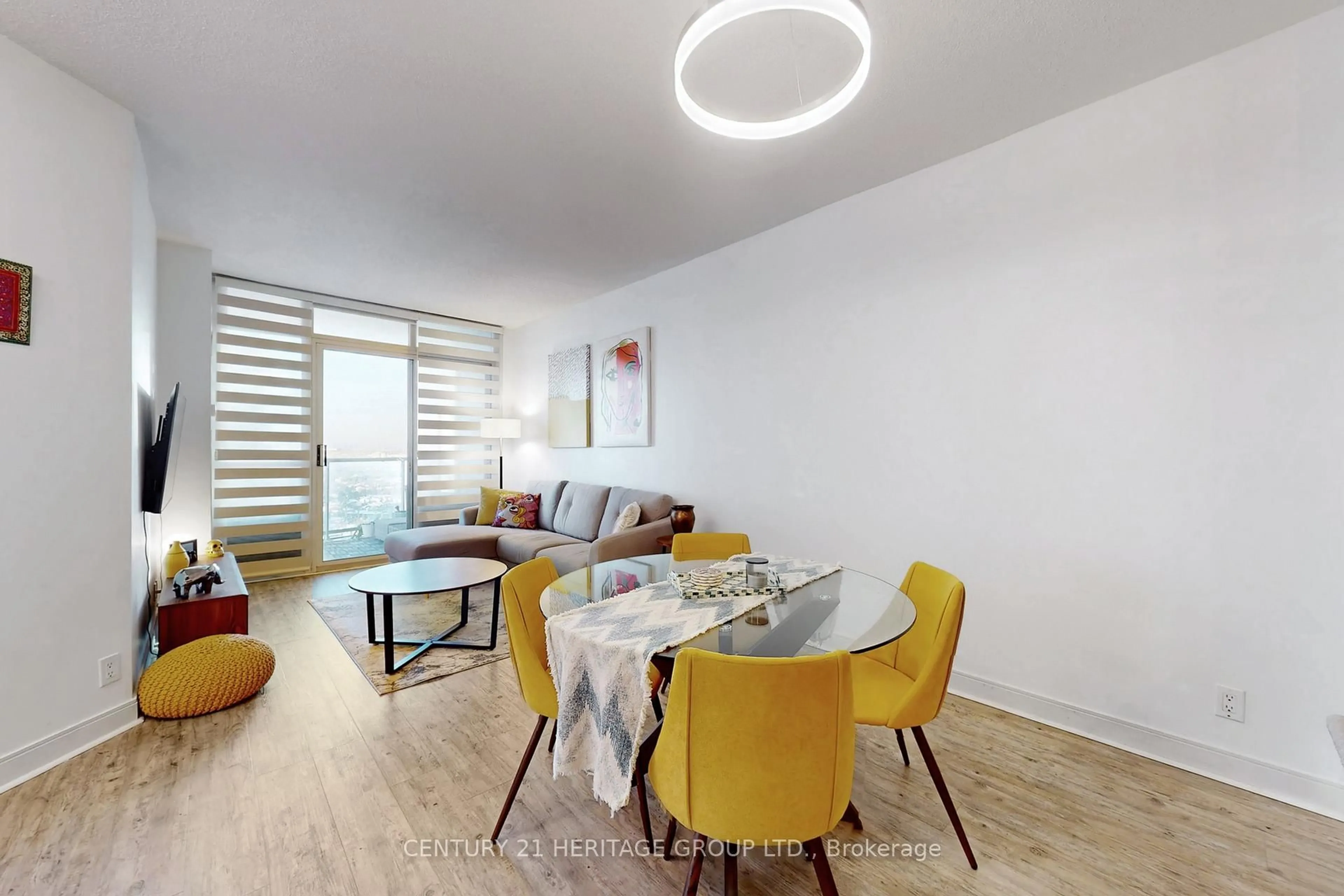 Living room with furniture, wood/laminate floor for 70 Absolute Ave #2410, Mississauga Ontario L4Z 0A4