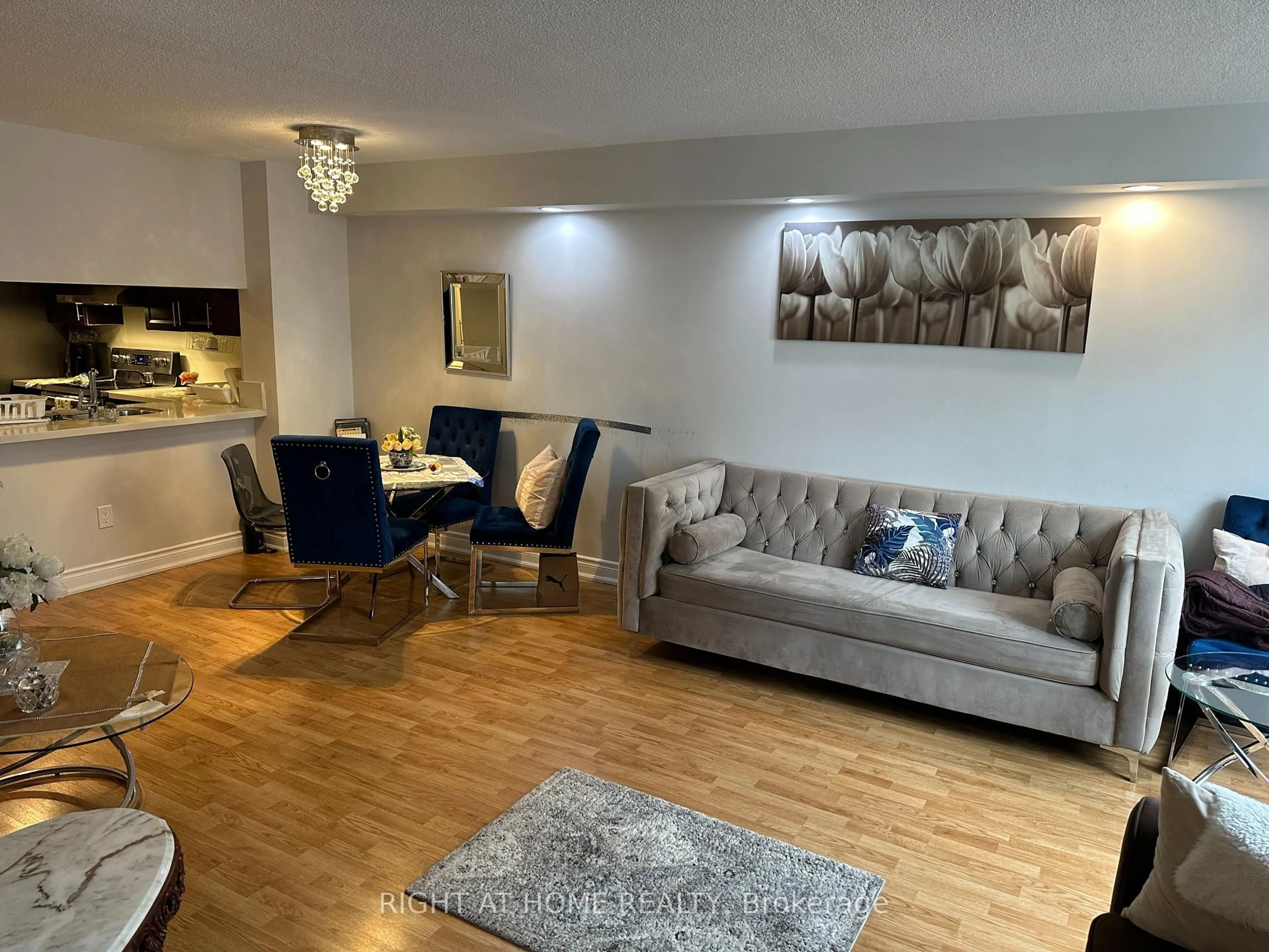 Living room with furniture, wood/laminate floor for 300 Webb Dr #1406, Mississauga Ontario L5B 3W3