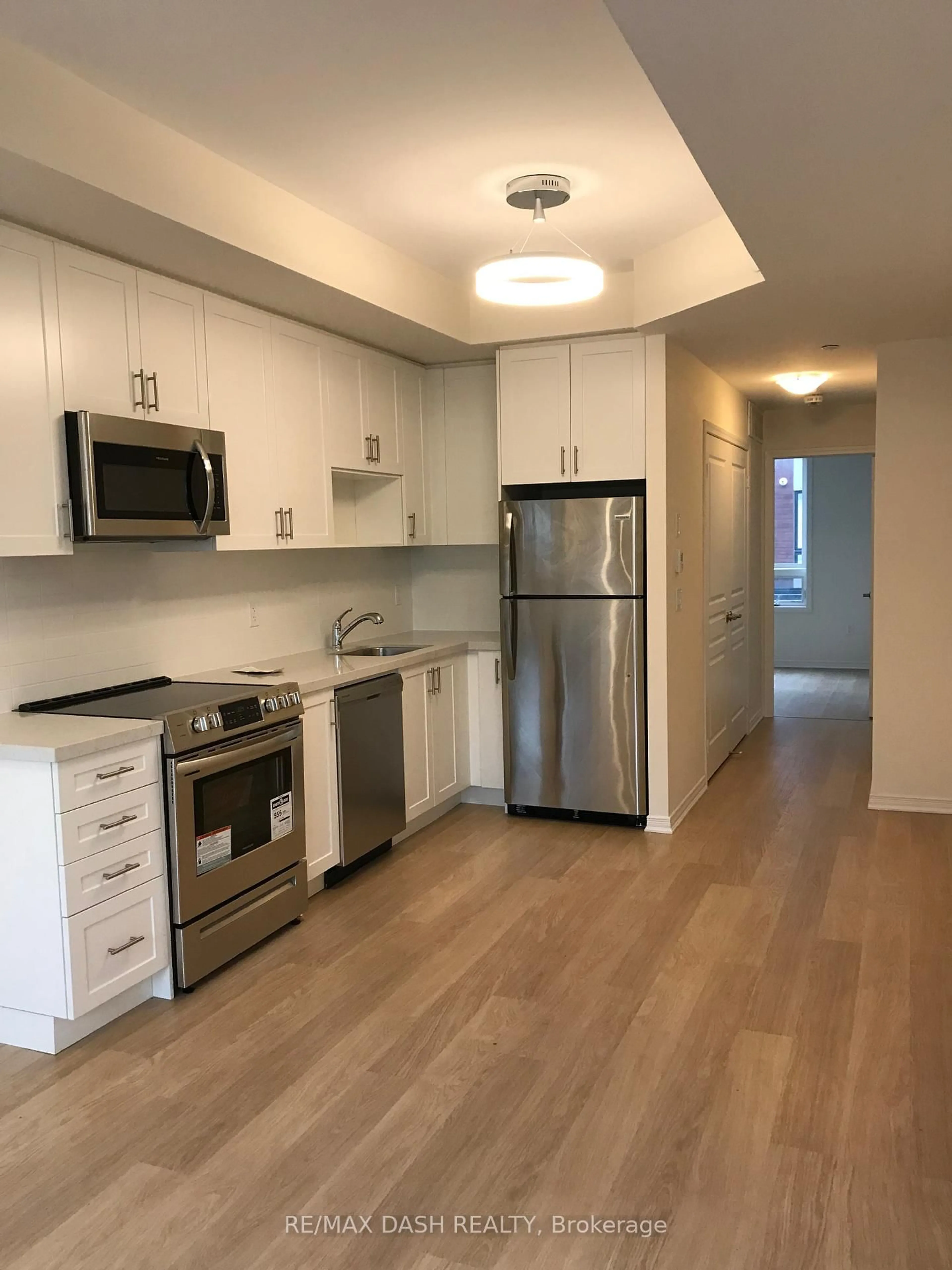 Standard kitchen, wood/laminate floor for 1130 Briar Hill Ave #204, Toronto Ontario M6B 0A9