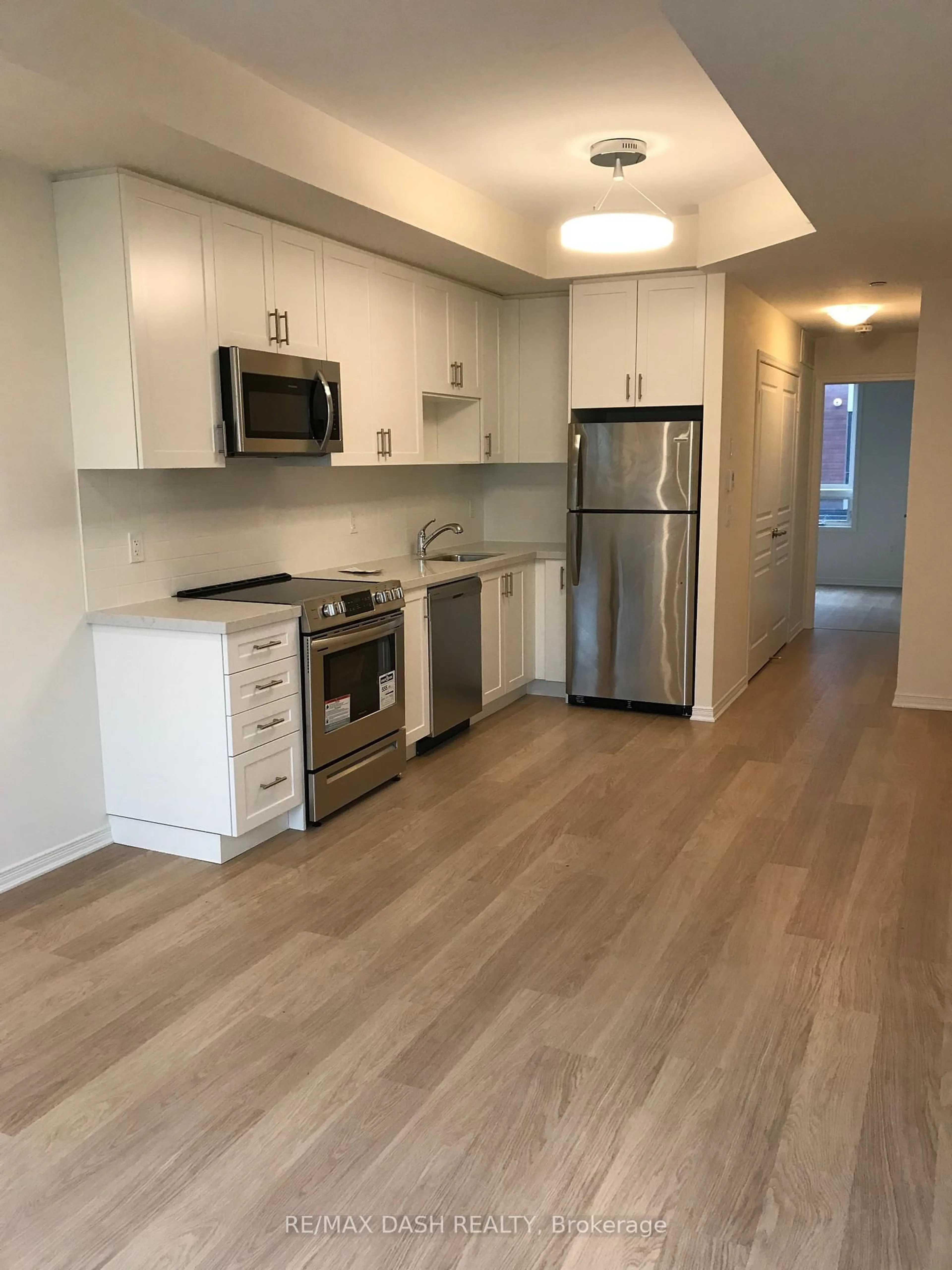 Standard kitchen, wood/laminate floor for 1130 Briar Hill Ave #204, Toronto Ontario M6B 0A9