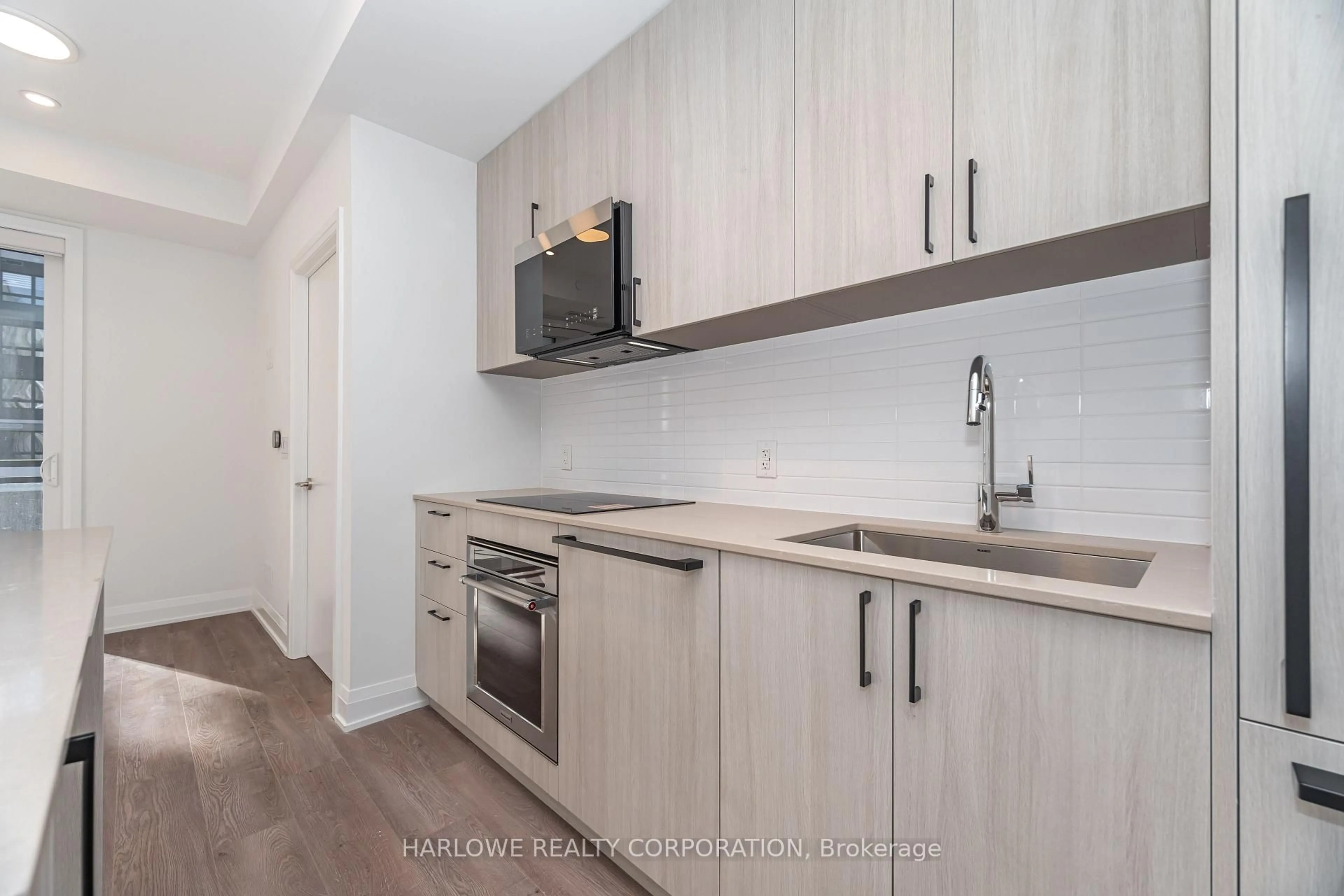 Standard kitchen, wood/laminate floor for 3250 Carding Mill Tr #208, Oakville Ontario L6M 1L3