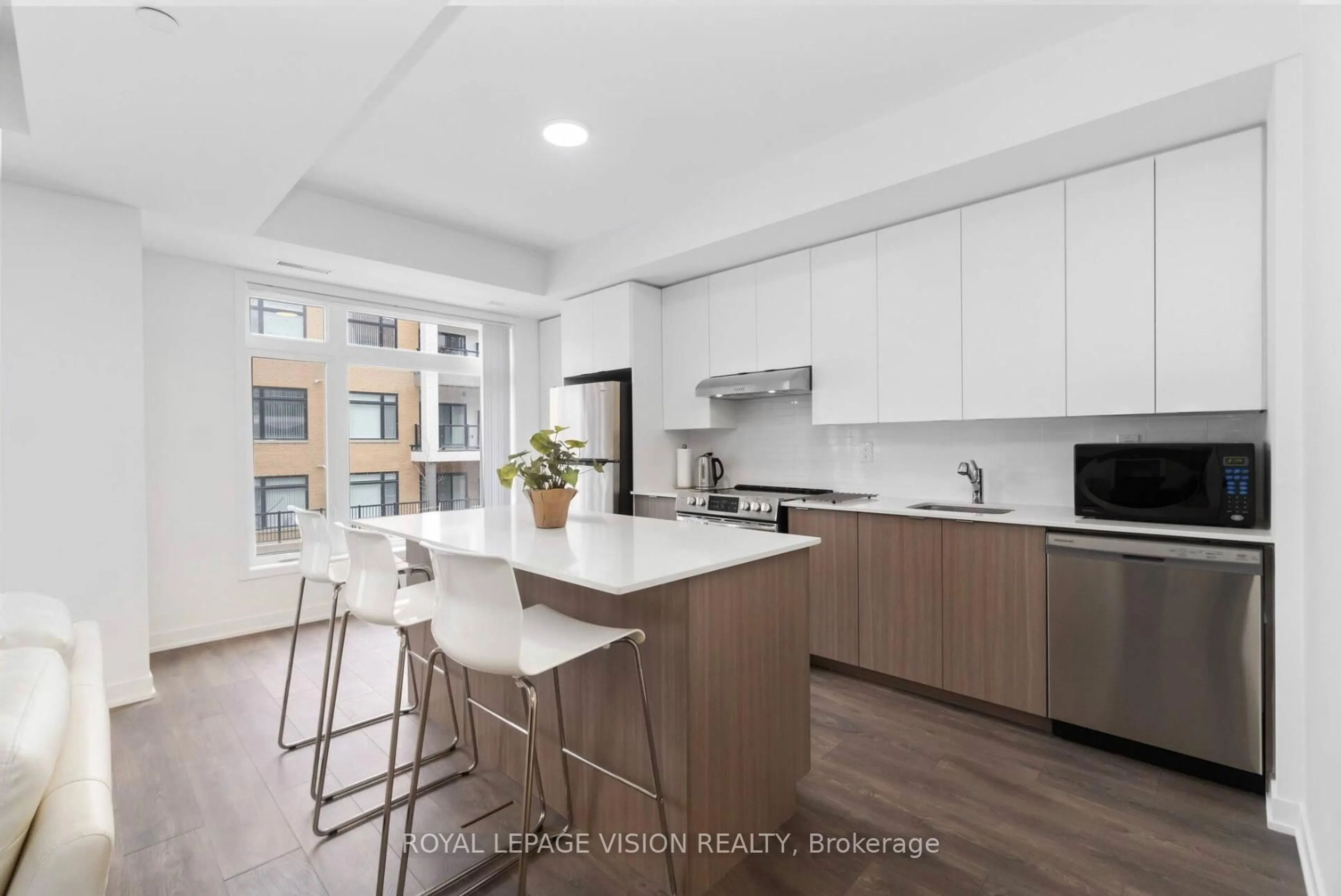 Open concept kitchen, unknown for 130 Canon Jackson Dr #209, Toronto Ontario M6M 0B7