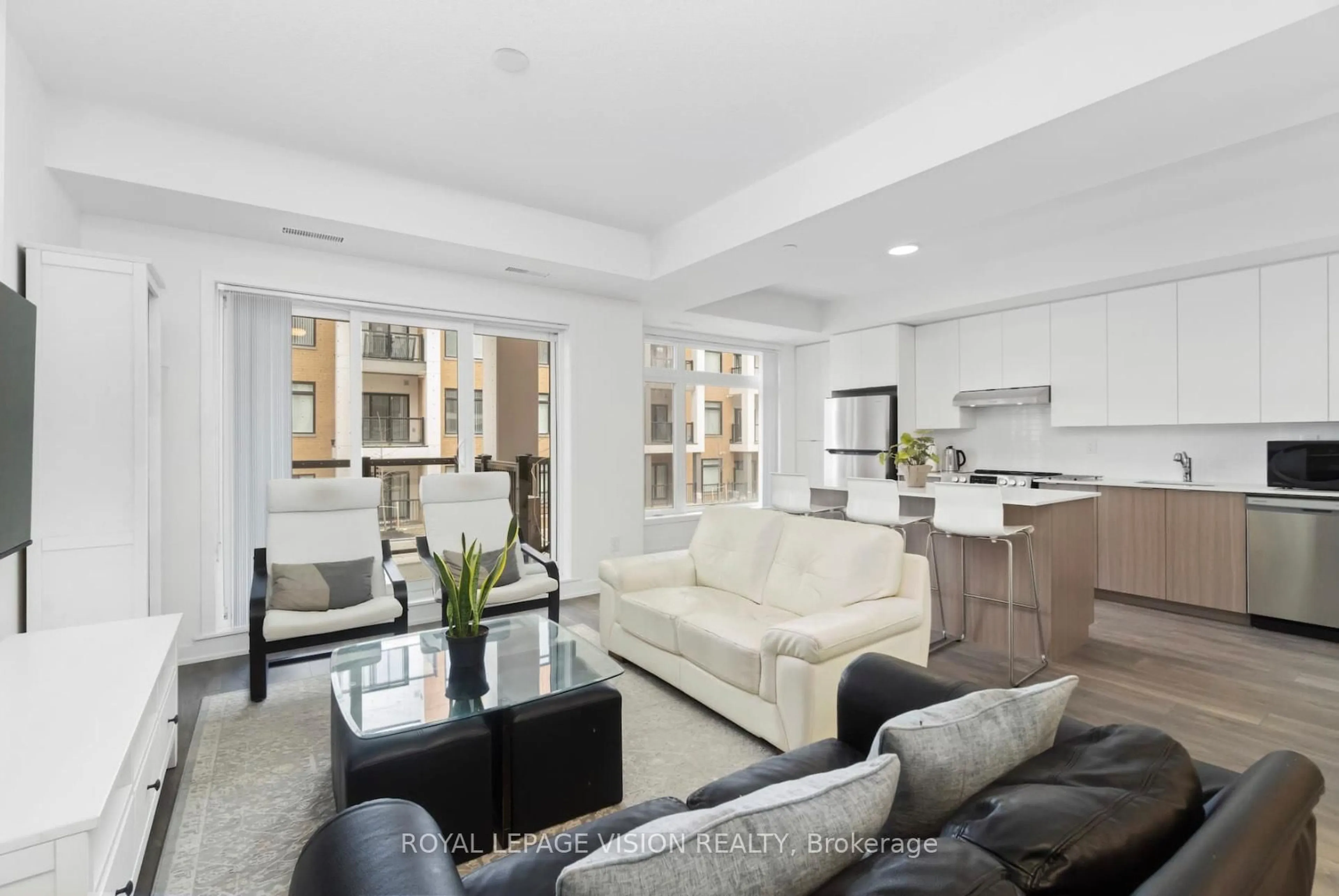 Living room with furniture, unknown for 130 Canon Jackson Dr #209, Toronto Ontario M6M 0B7