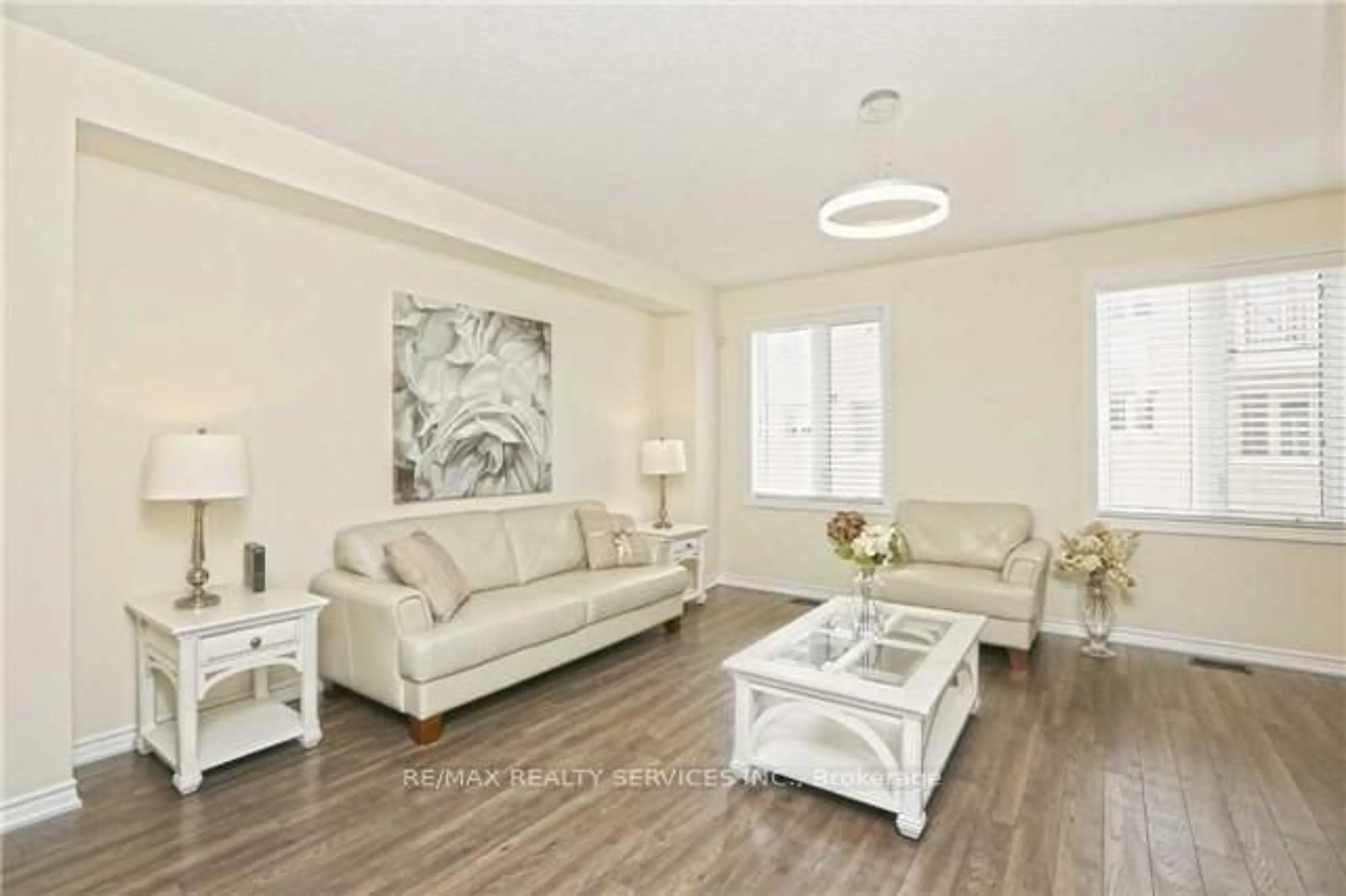 Living room with furniture, wood/laminate floor for 10 Rabbit Run Way, Brampton Ontario L6Z 0J2