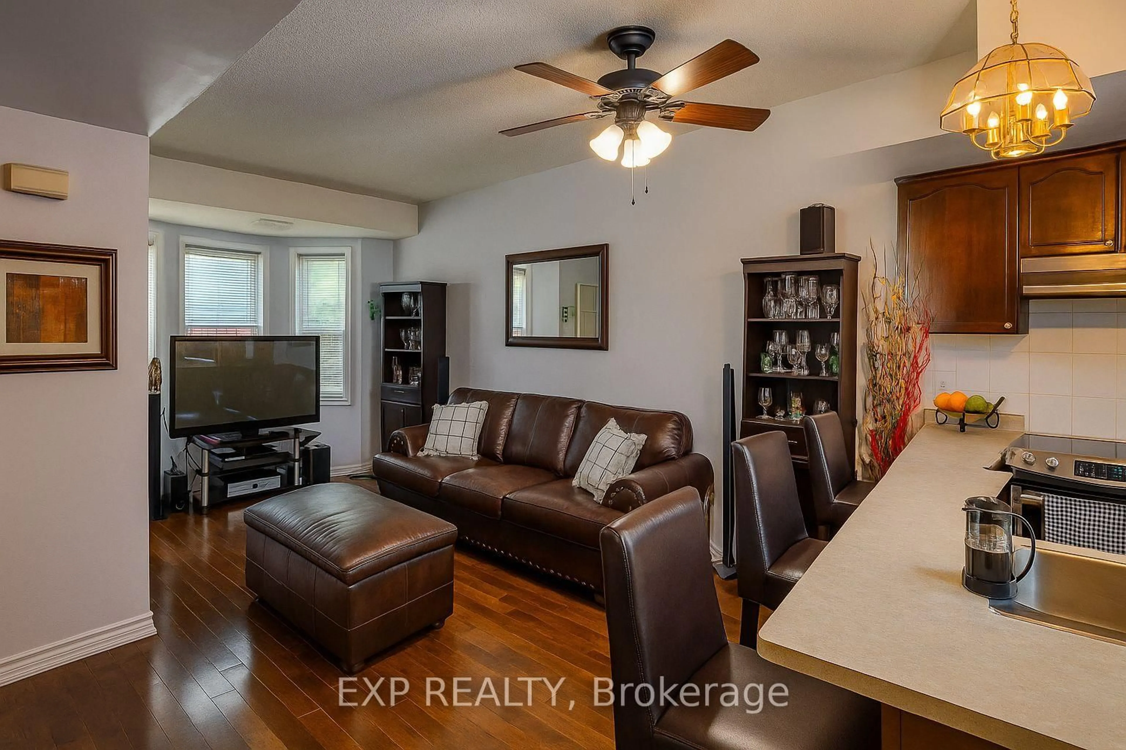 Living room with furniture, wood/laminate floor for 760 Lawrence Ave #132, Toronto Ontario M6A 3E7