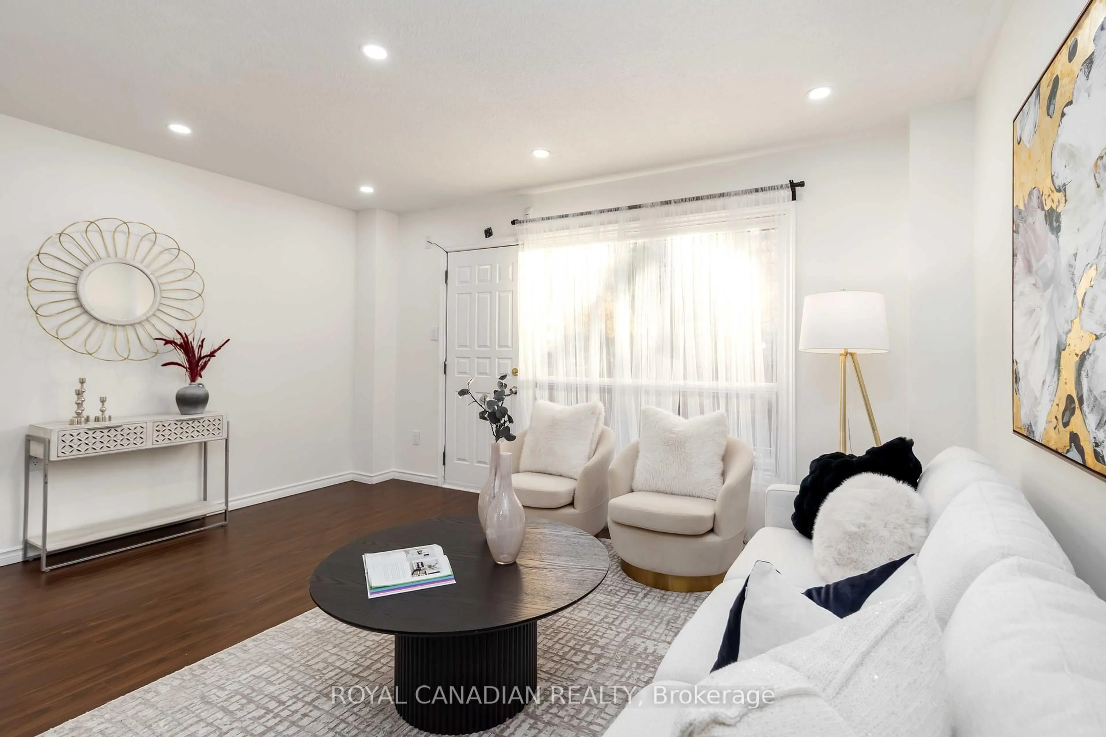 Living room with furniture, wood/laminate floor for 475 Bramalea Rd #106, Brampton Ontario L6T 2X2