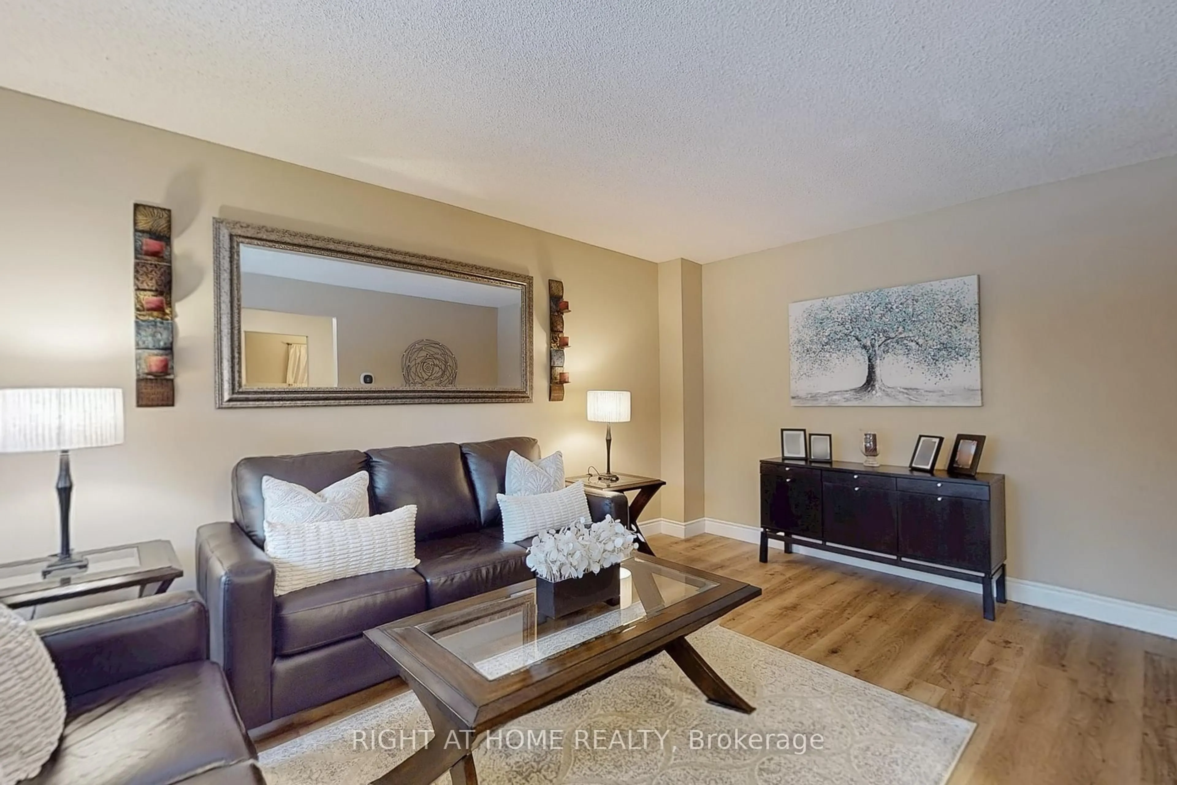 Living room with furniture, wood/laminate floor for 2737 Hammond Rd, Mississauga Ontario L5K 2M5