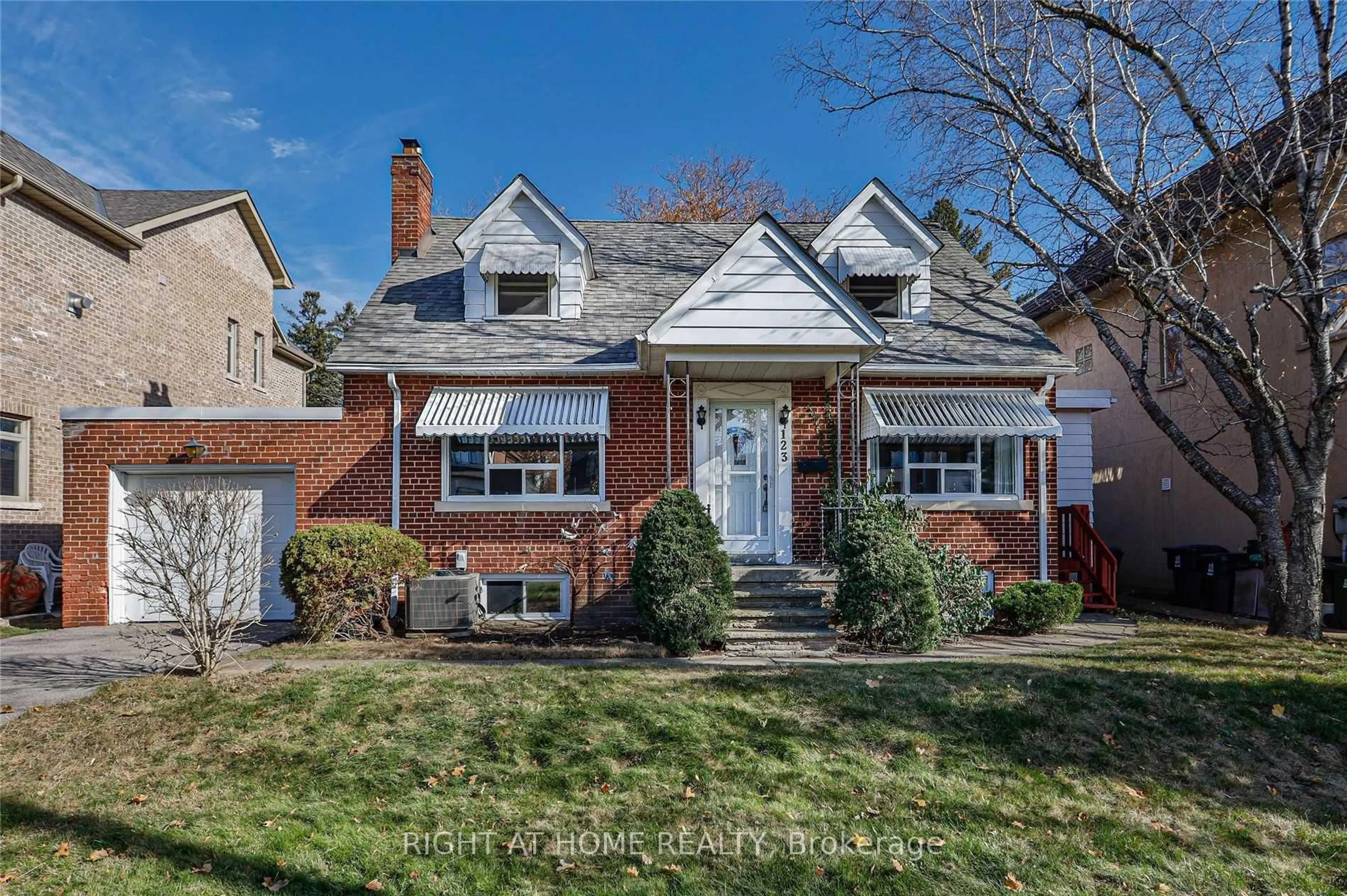 Home with brick exterior material, street for 123 Ashbourne Dr, Toronto Ontario M9B 4H9