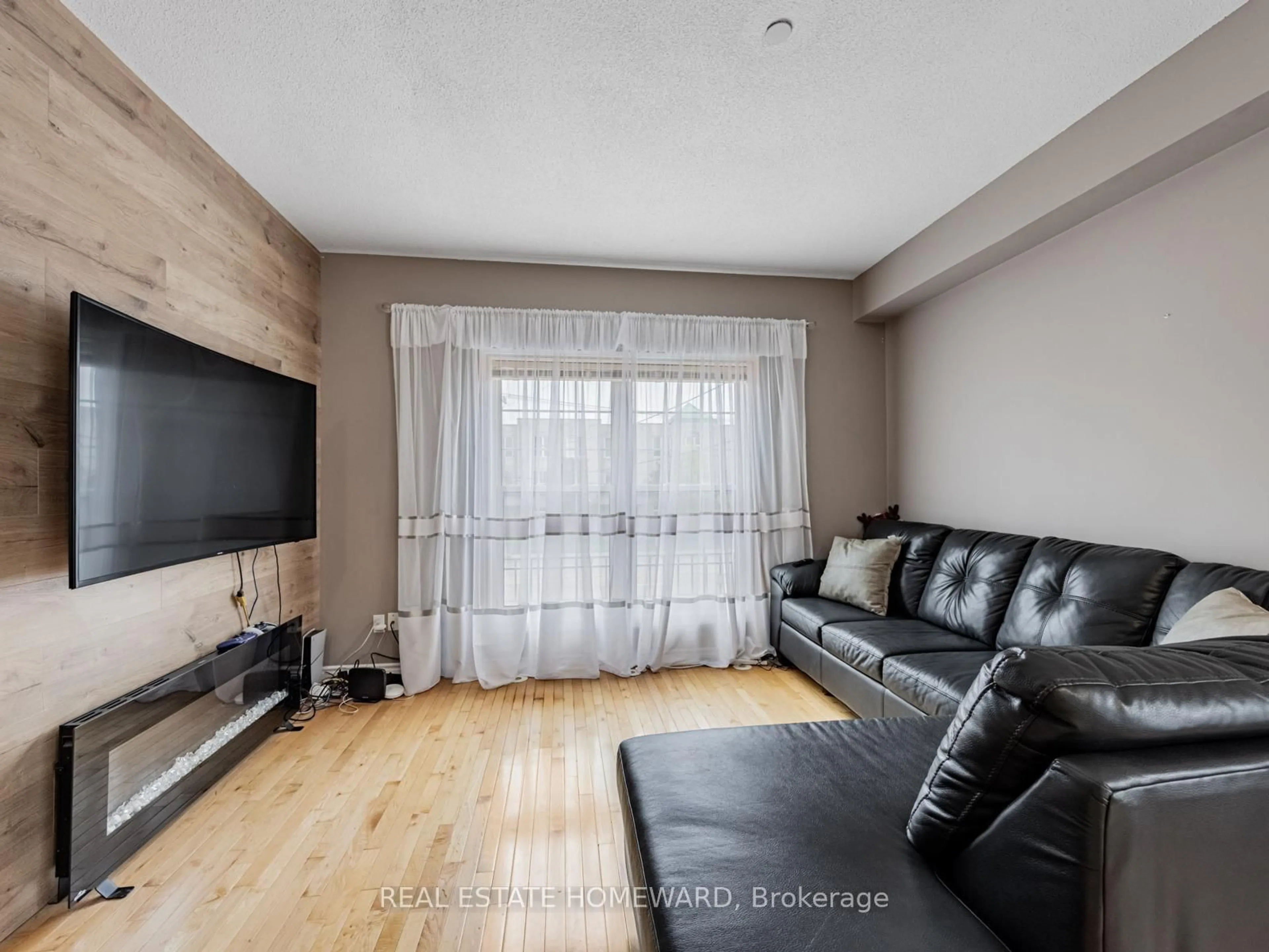 Living room with furniture, wood/laminate floor for 964A The Queensway, Toronto Ontario M8Z 1P5