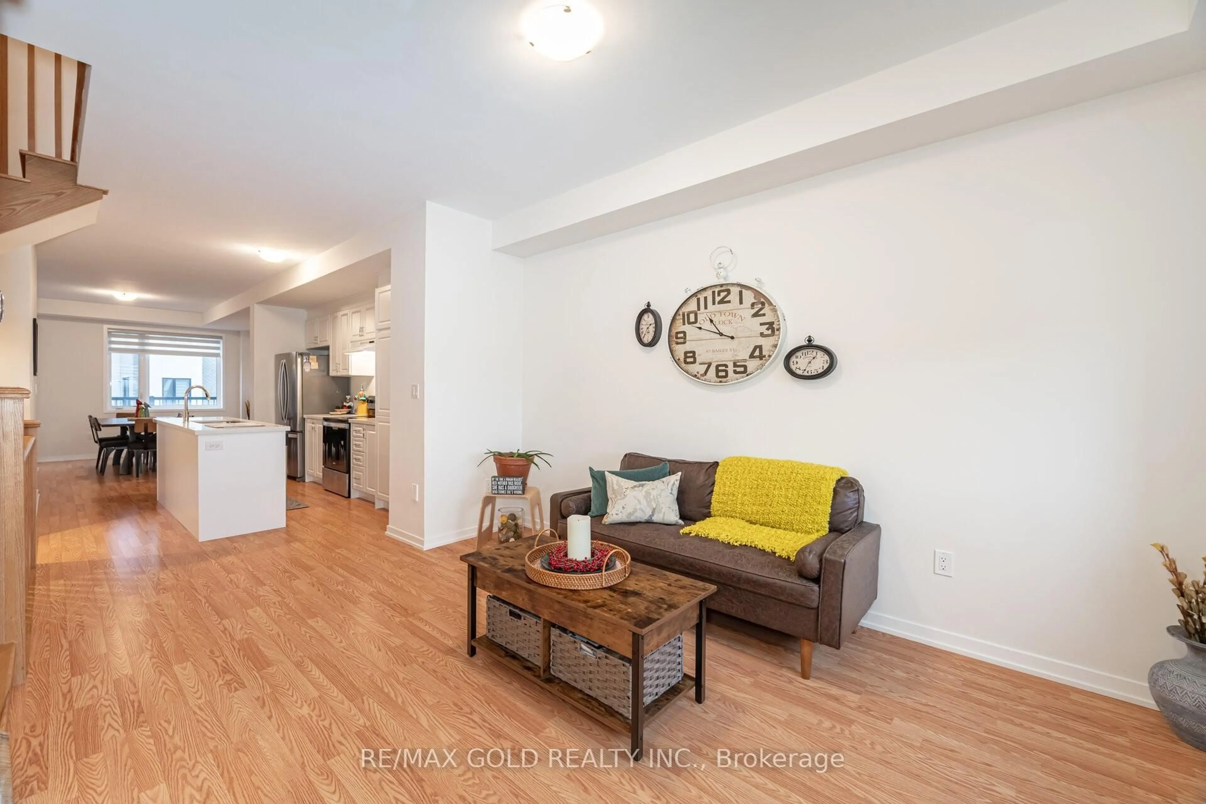 Living room with furniture, wood/laminate floor for 56 Lambert Lane, Caledon Ontario L7E 4M5