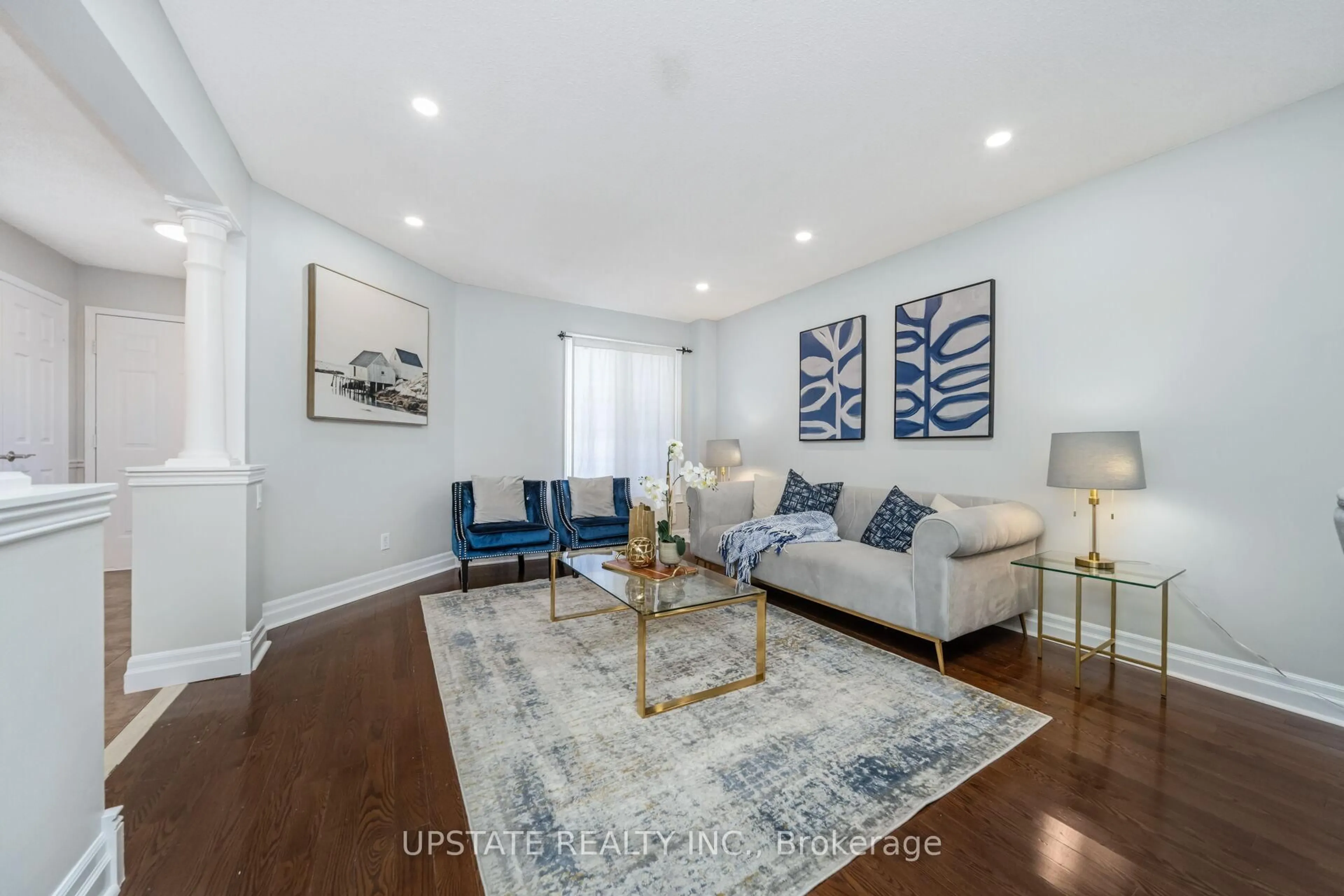 Living room with furniture, wood/laminate floor for 7311 Black Walnut Tr, Mississauga Ontario L5N 7M4