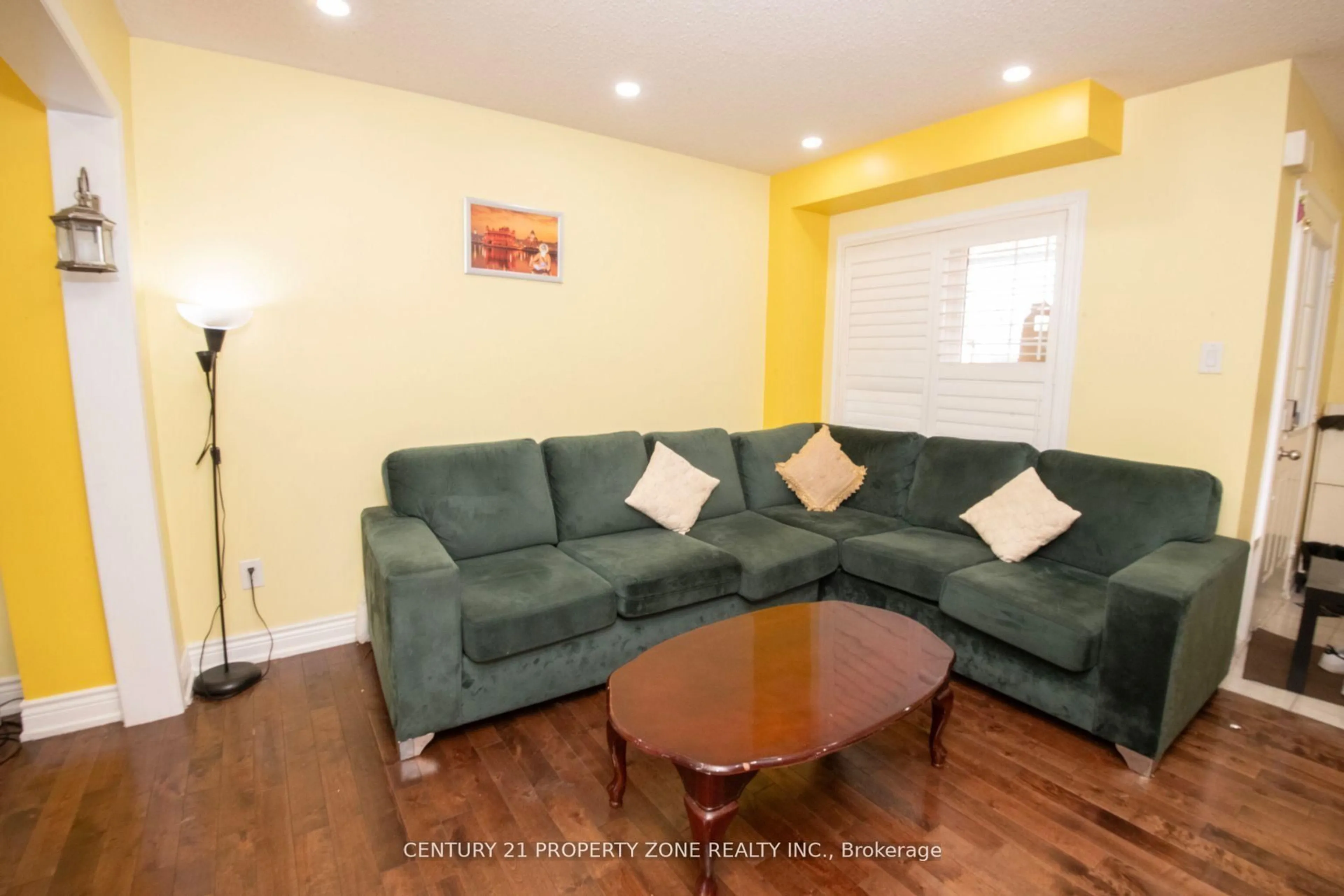 Living room with furniture, wood/laminate floor for 32 Summerdale Cres, Brampton Ontario L6X 4V8