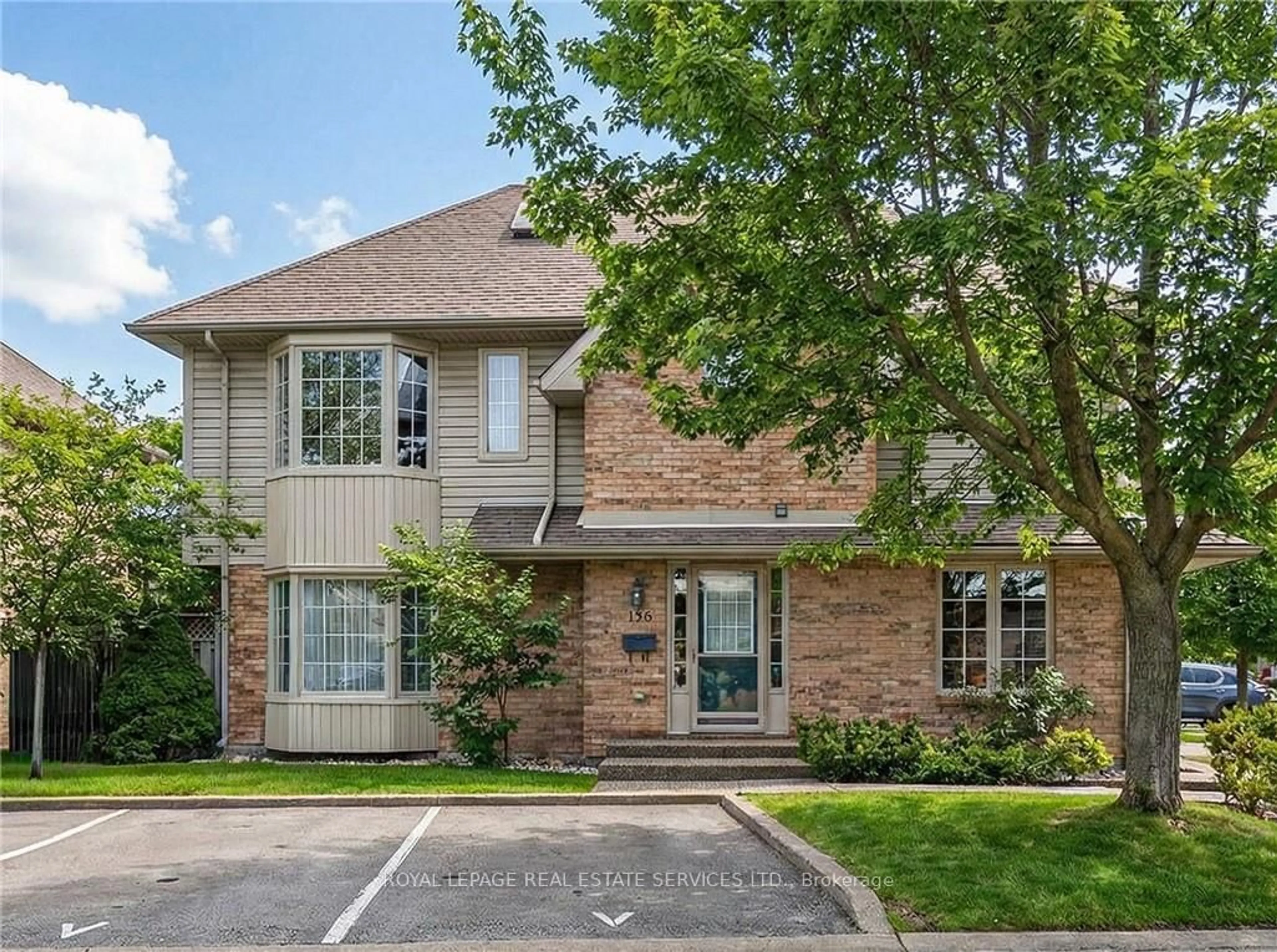 Home with brick exterior material, street for 3333 New St #120, Burlington Ontario L7N 1N1